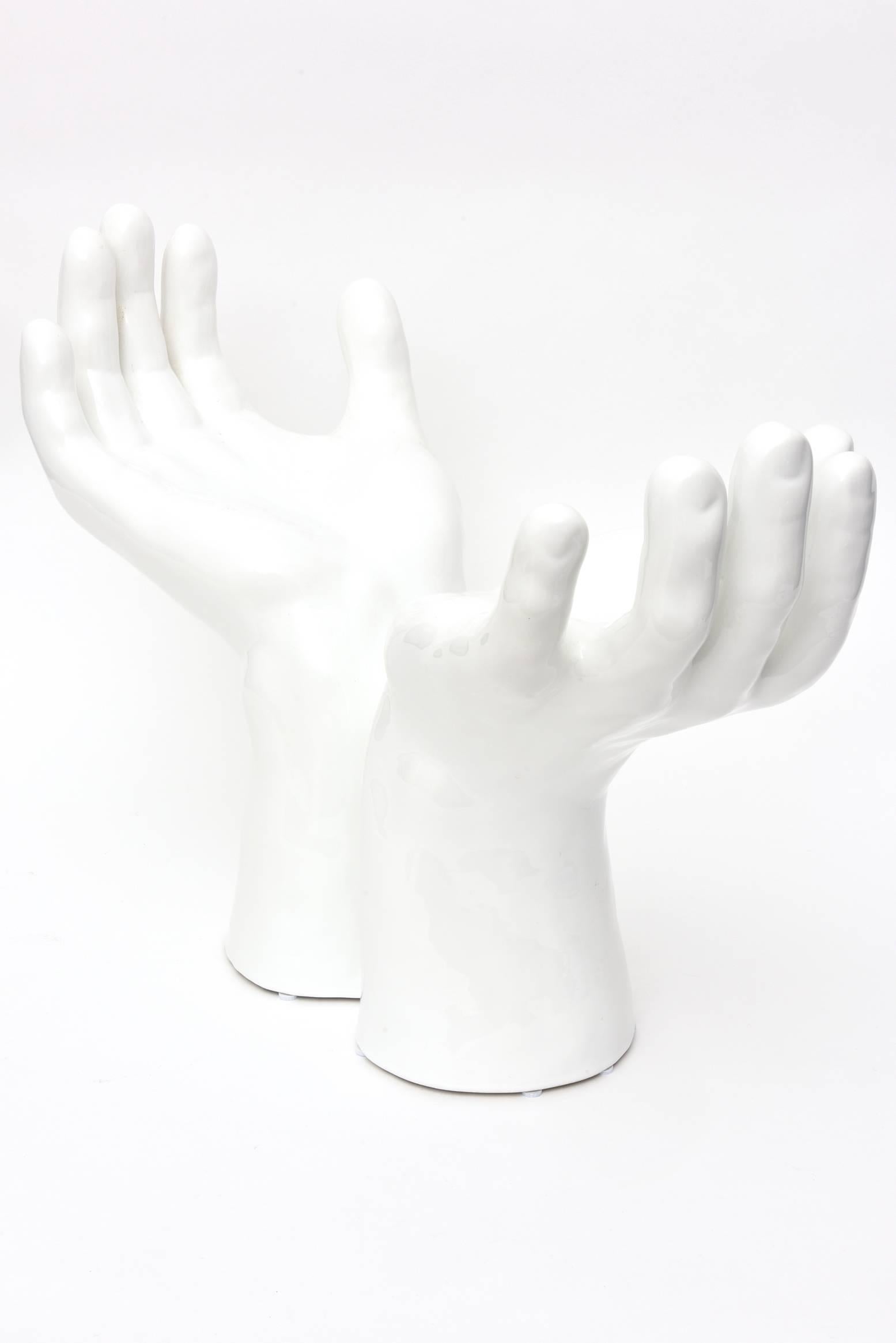 This wonderful Italian dramatic white glazed hands sculpture is an encompassing energy welcome object with outstretched large male hands. It is monumental and theatrical. This is from the 1970s. Does he have the world is his hands? The original