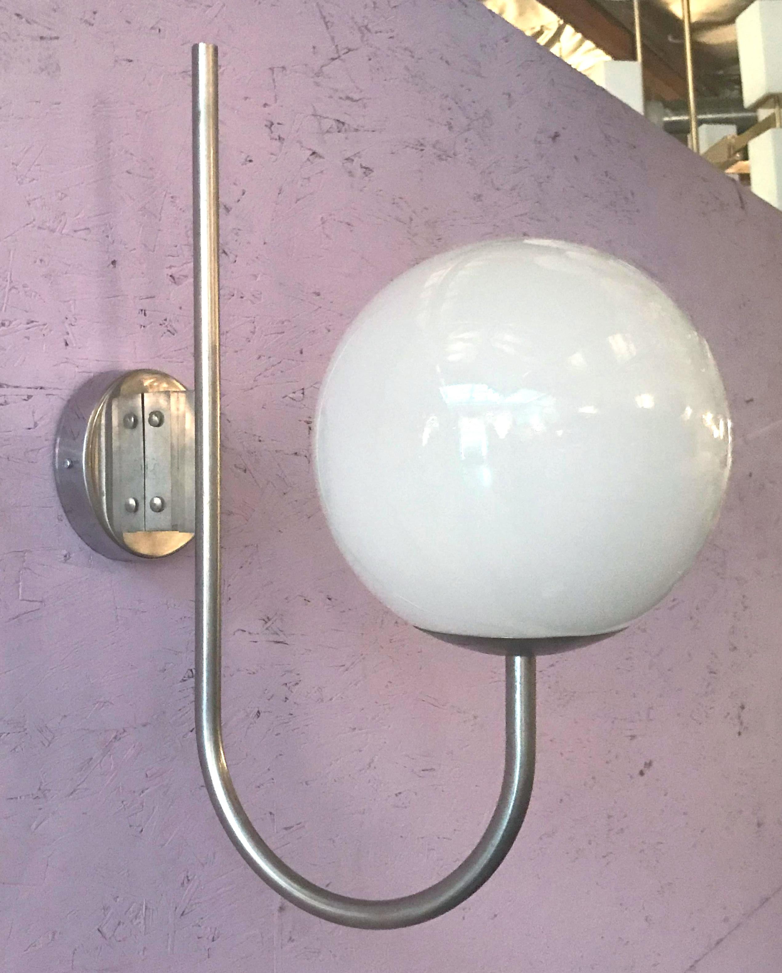 Vintage Italian wall light with glossy white Murano glass globe mounted on nickel metal frame / Designed by Sergio Mazza, circa 1960’s / Made in Italy
1 light / E26 or E27 type / max 40W each
Height: 24 inches / Width: 9 inches / Depth: 17 inches
1