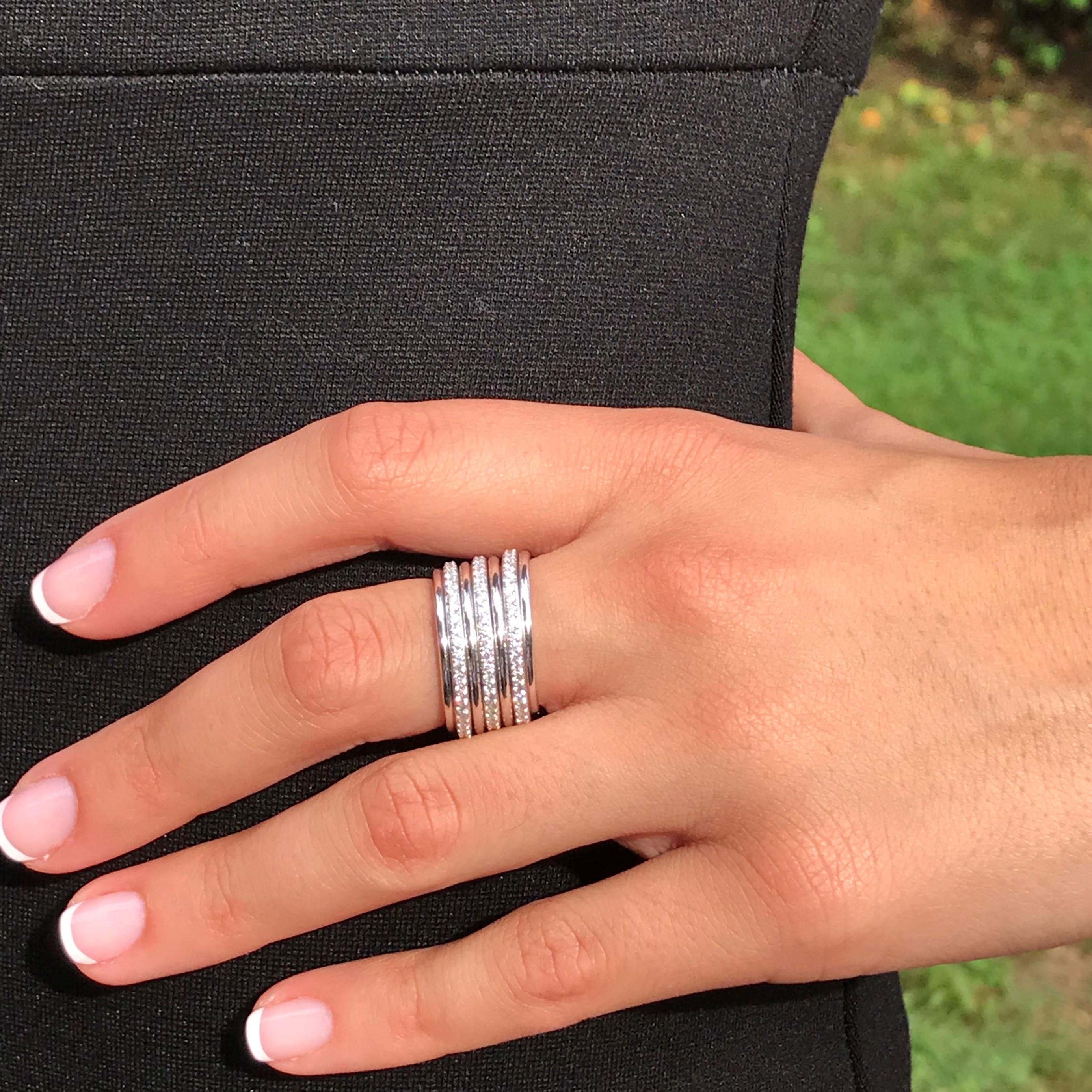 Our Italian designer have created this unique look with white gold and diamond multilayer band ring , all link together to achieve a special effect. The clean lines create a look of timeless radiance, a pure feminine style for that special unique
