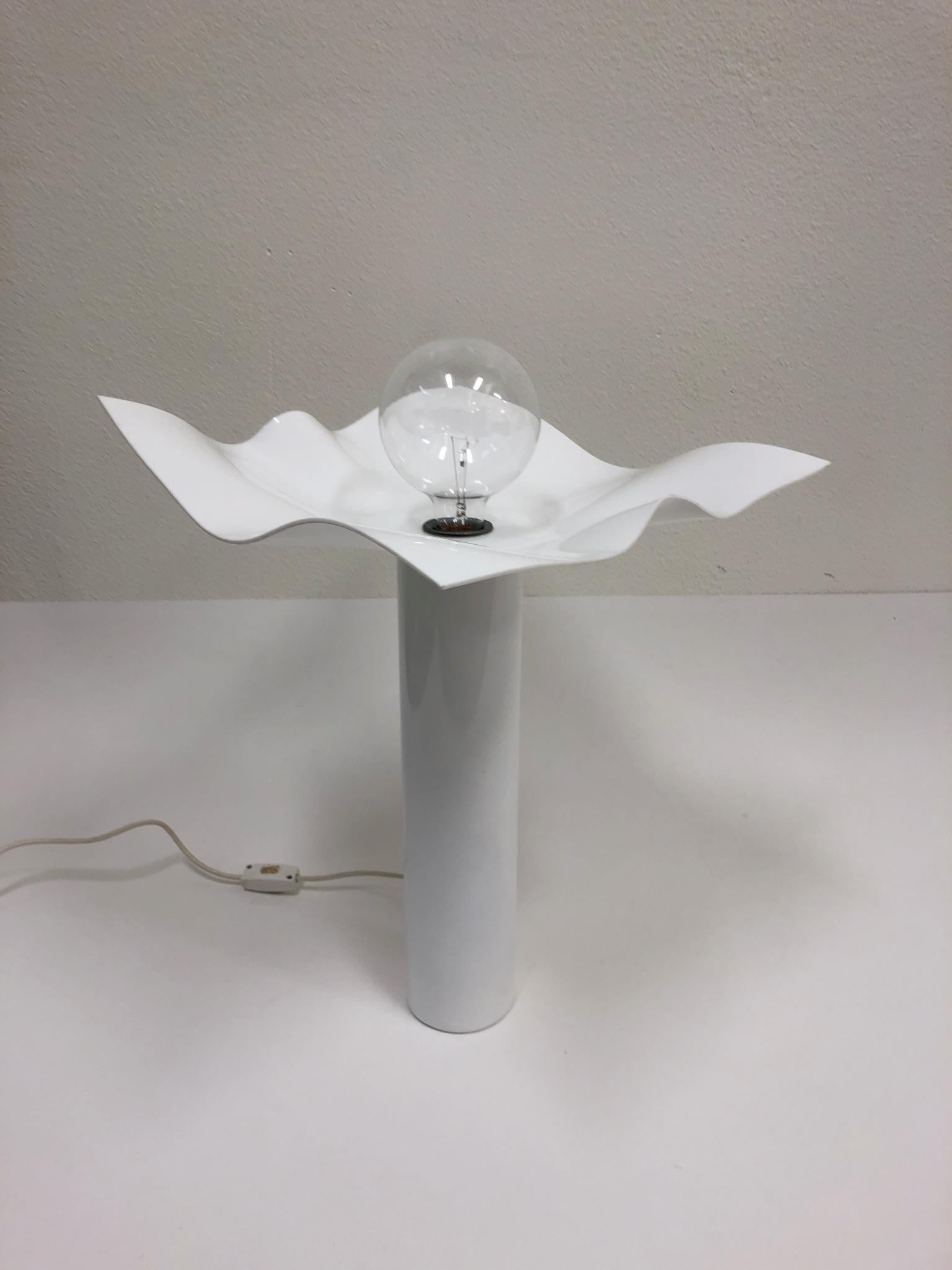 A beautiful Italian handkerchief table lamp from the 1960s. 
The lamp is constructed of white acrylic with a white powder coated steel base. Newly rewired. 

Dimensions: 23.5” high, 16” wide, 16” deep.
