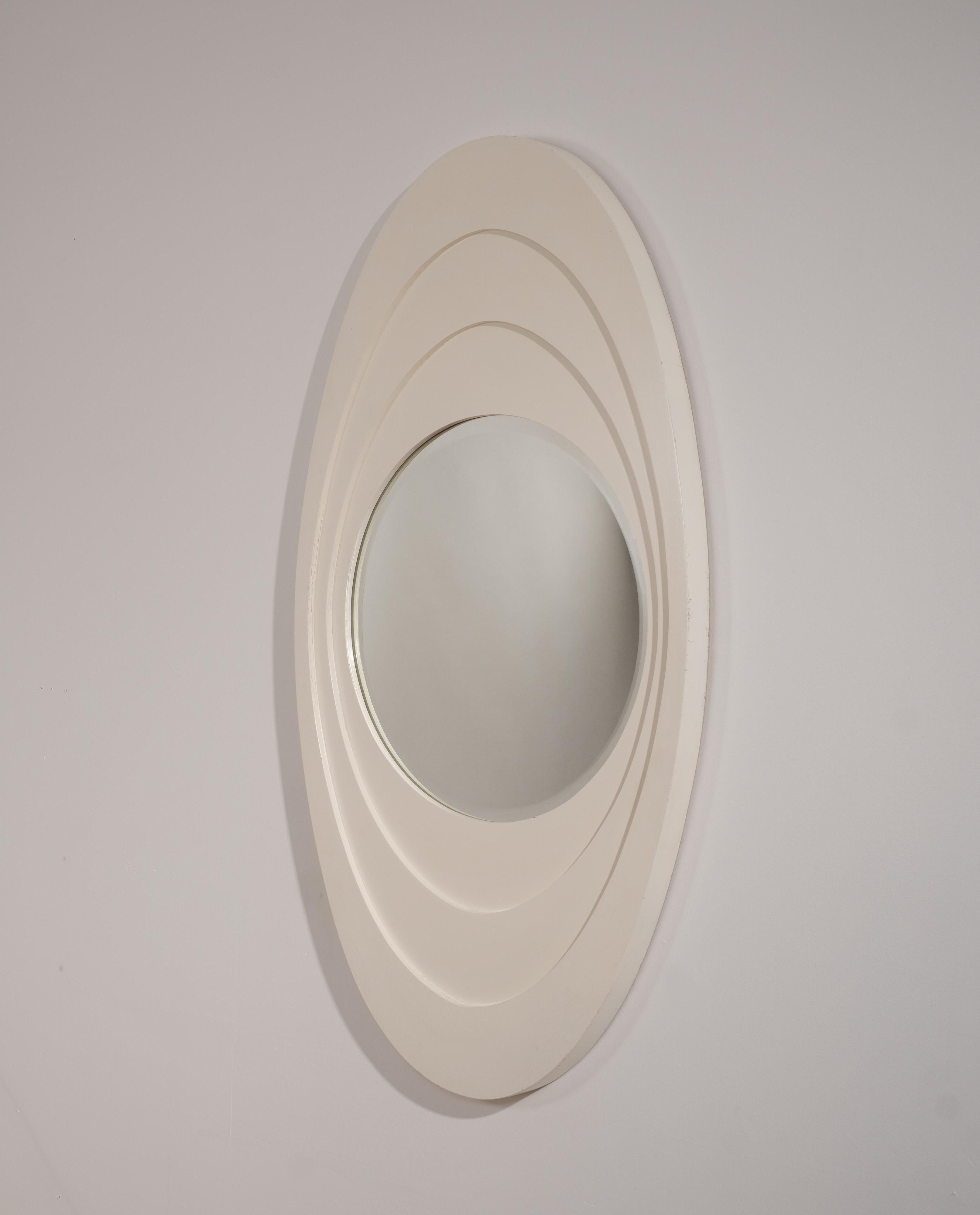 White lacquered wooden mirror produced in Italy around 1960. This elegant piece showcases the refined craftsmanship and minimalist sophistication characteristic of Italian mid-century and early Space Age design. The frame features a smooth white