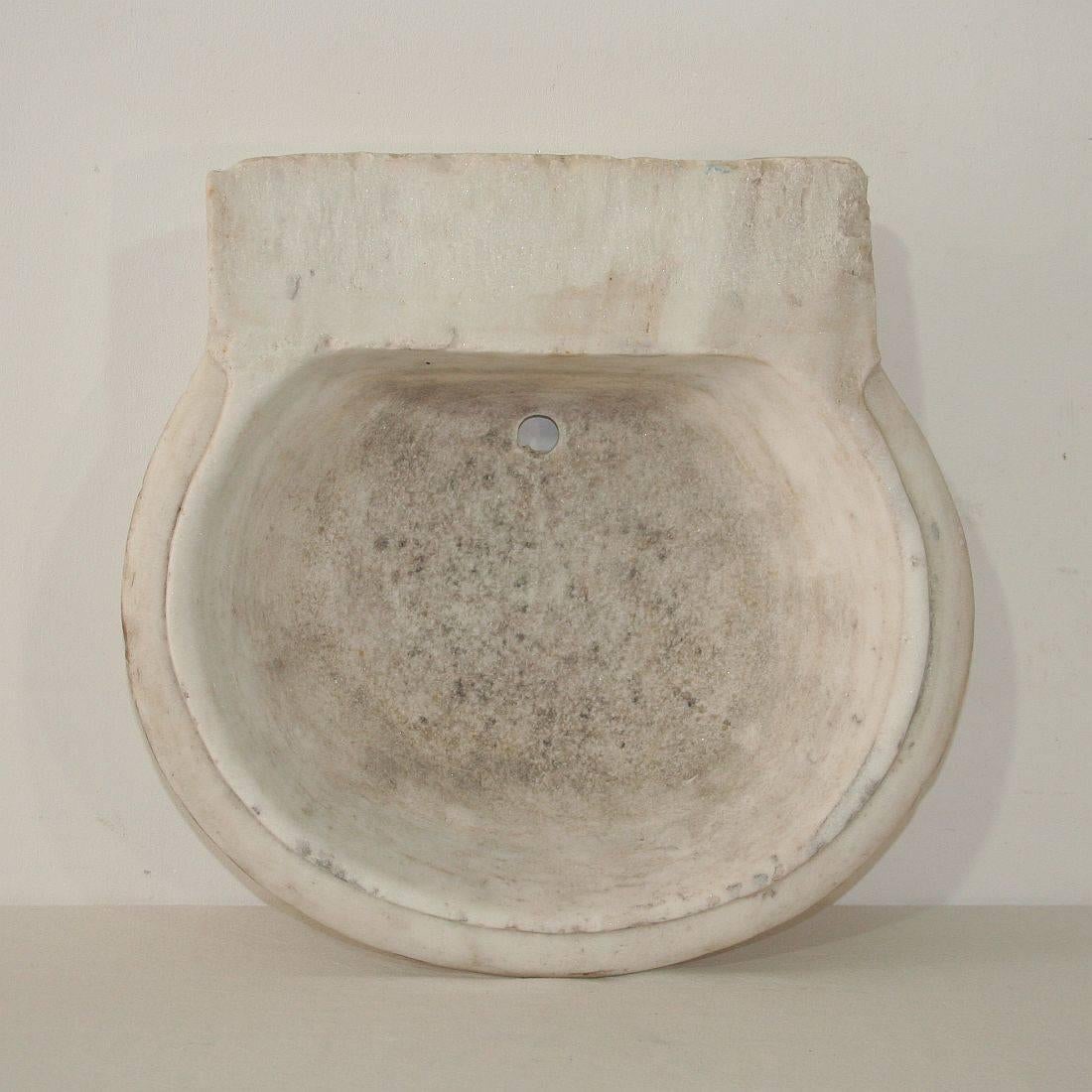 Beautiful hand-carved white marble water basin or sink, Italy, circa 1750-1800. Weathered.
