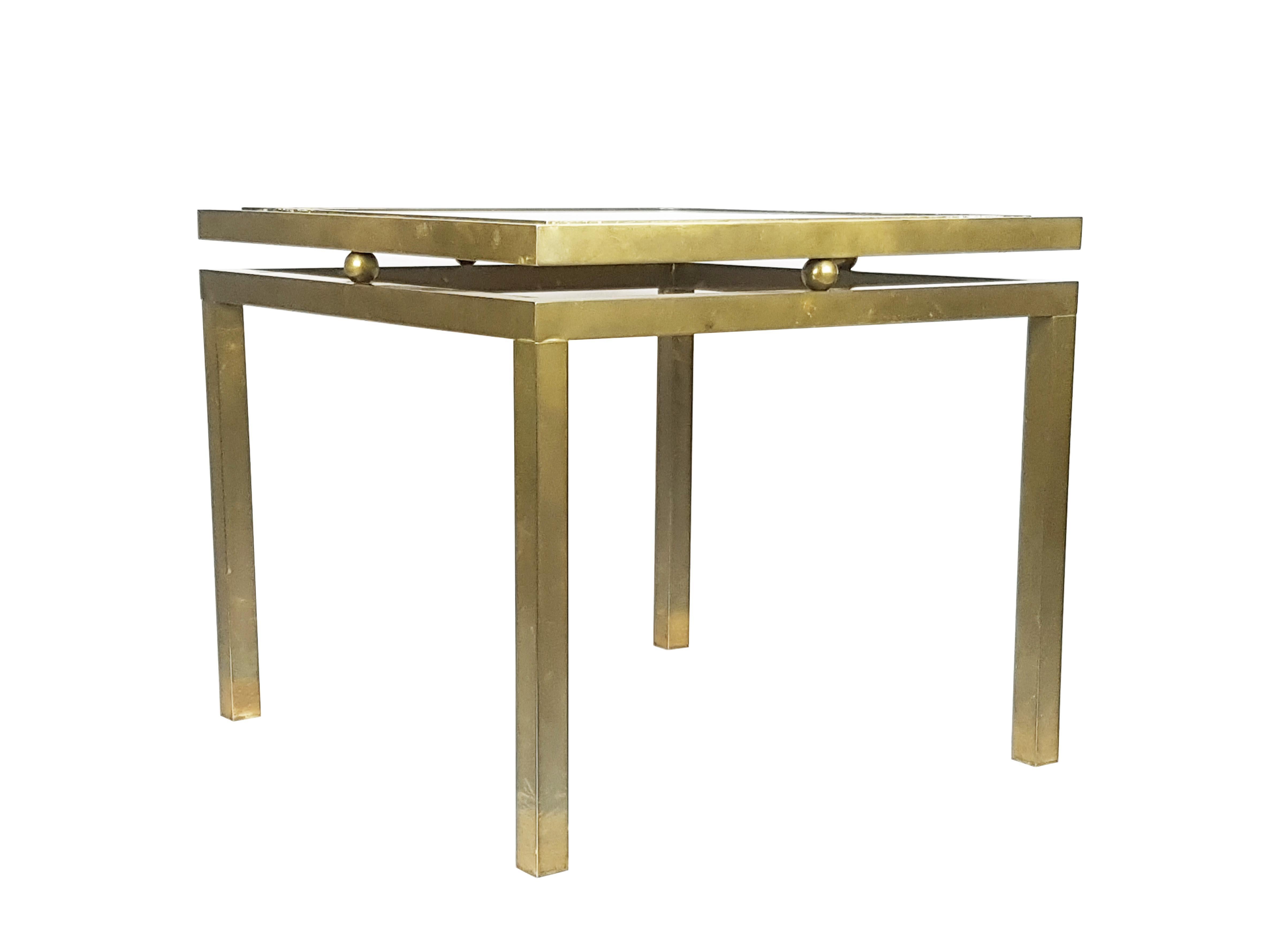 This elegant coffee table was produced in Italy around the 1970s. It is made from a brass structure with a white marble top.
The table remains in very good vintage condition: uniform oxidation patina of the brass. very light scratches on the marble.