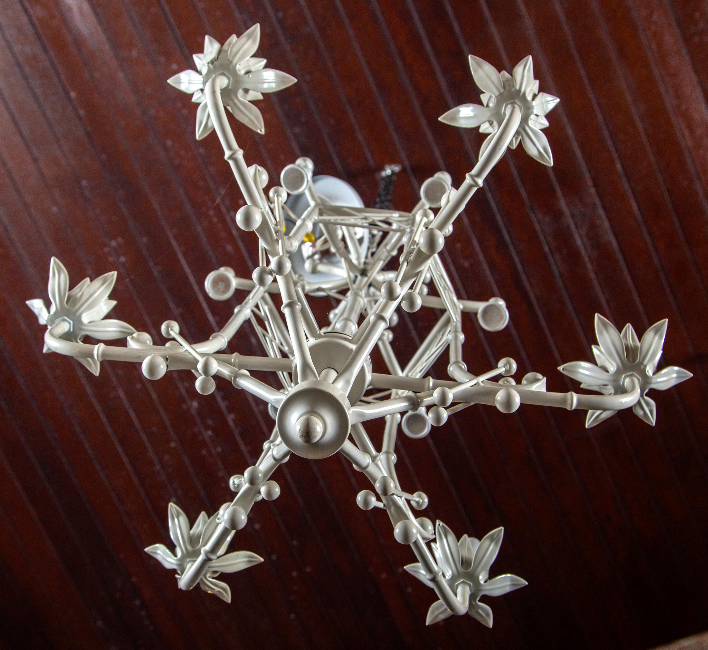 Small intricate chinoiserie chandelier with ball, bells, fretwork and canopy. It requires six chandelier size bulbs.