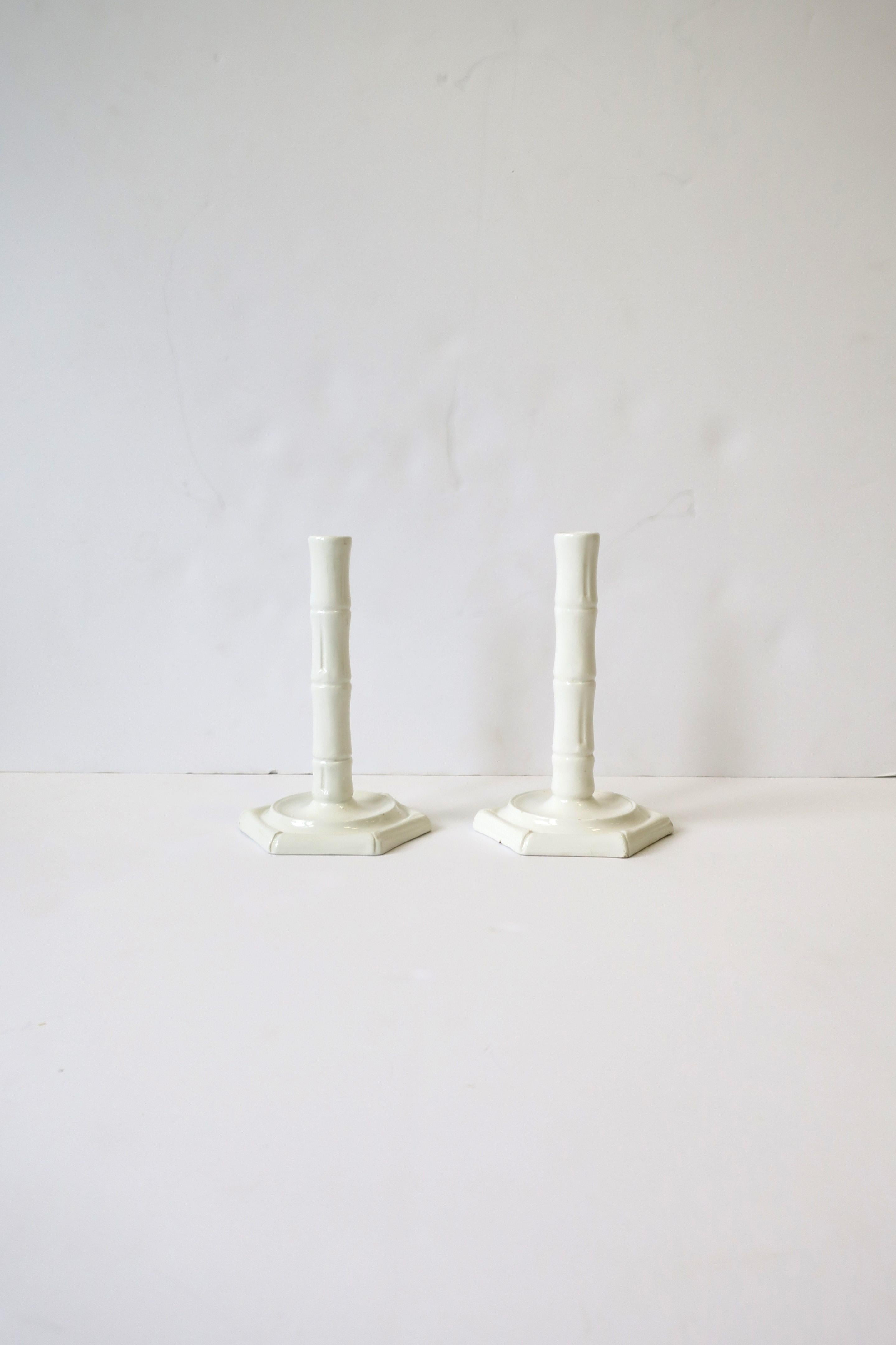 A pair of Italian white ceramic porcelain candlestick holders with bamboo design, in the Chinoiserie style, by Este Ceramiche Porcellane, circa mid-20th century, 1960s, Italy. Set has a hexagon base which is a nice alternative to round. With makers'