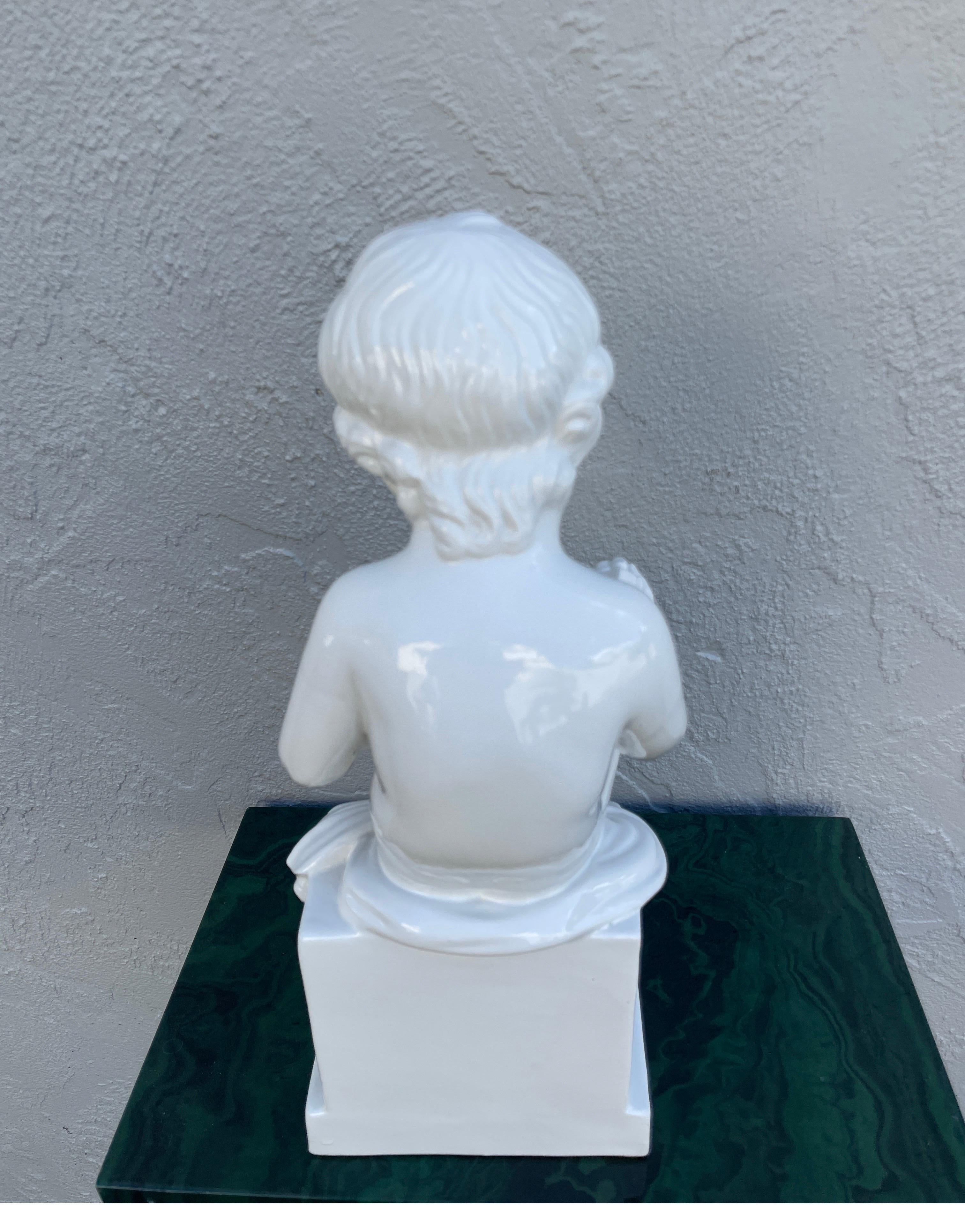 20th Century Italian White Porcelain Seated Putto Reading a Book For Sale