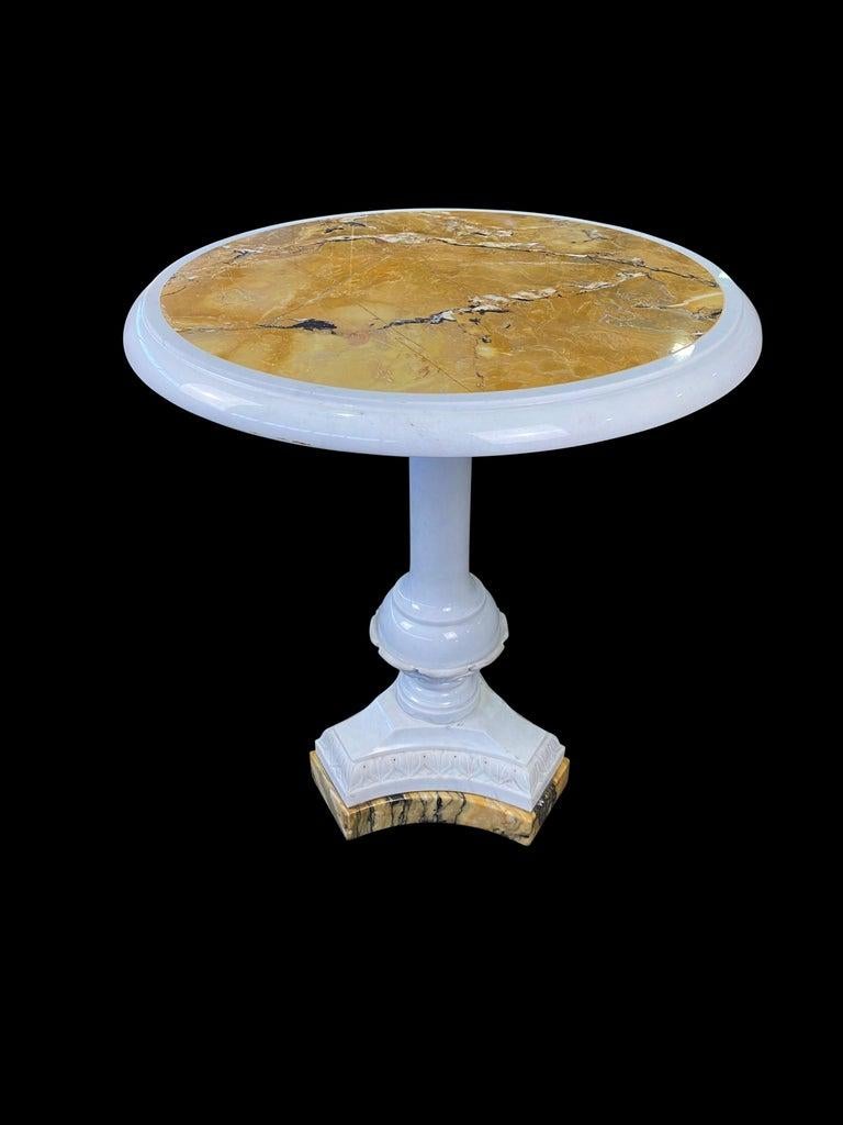 A striking and most unique Italian 19th-20th century white statuary and sienna marble centre table with specimen marble inlaid top. The table is raised by a tripod base with a natural, marbled design. Above is the baluster shaped central support