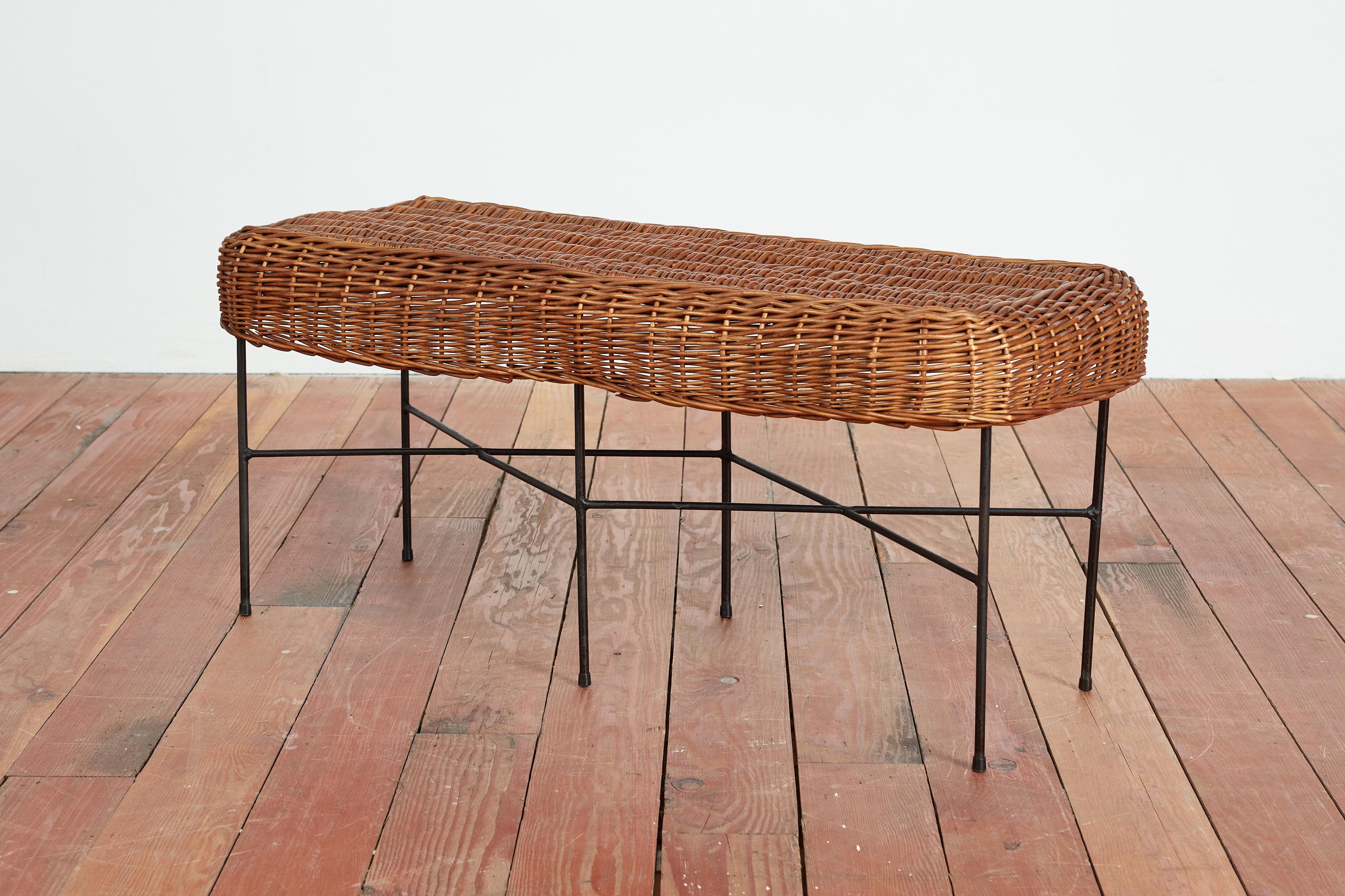 Great Italian wicker and iron bench with just the right amount of patina and charm. 