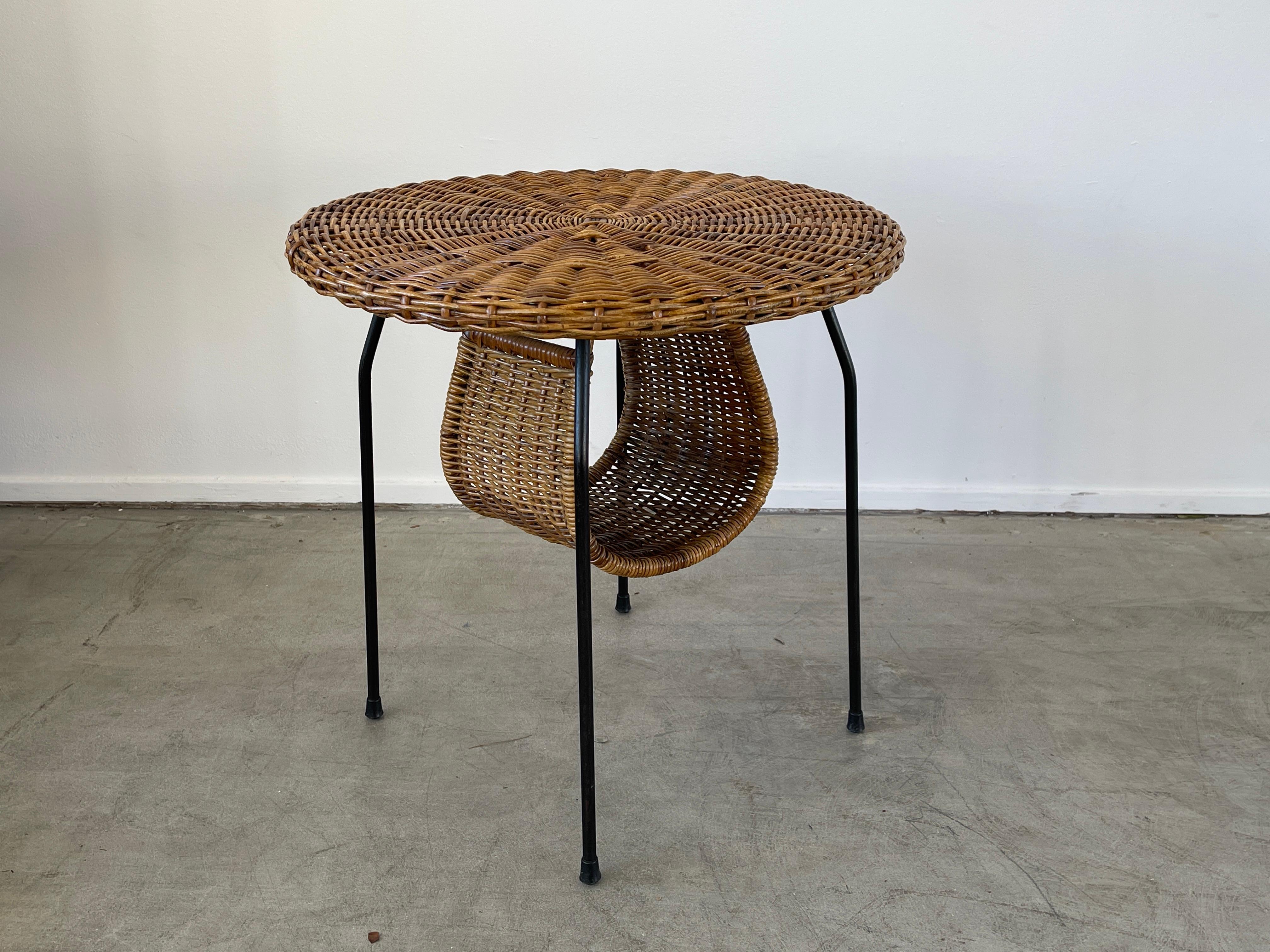 Fantastic shaped Wicker and Iron magazine table
Italy, 1950's.