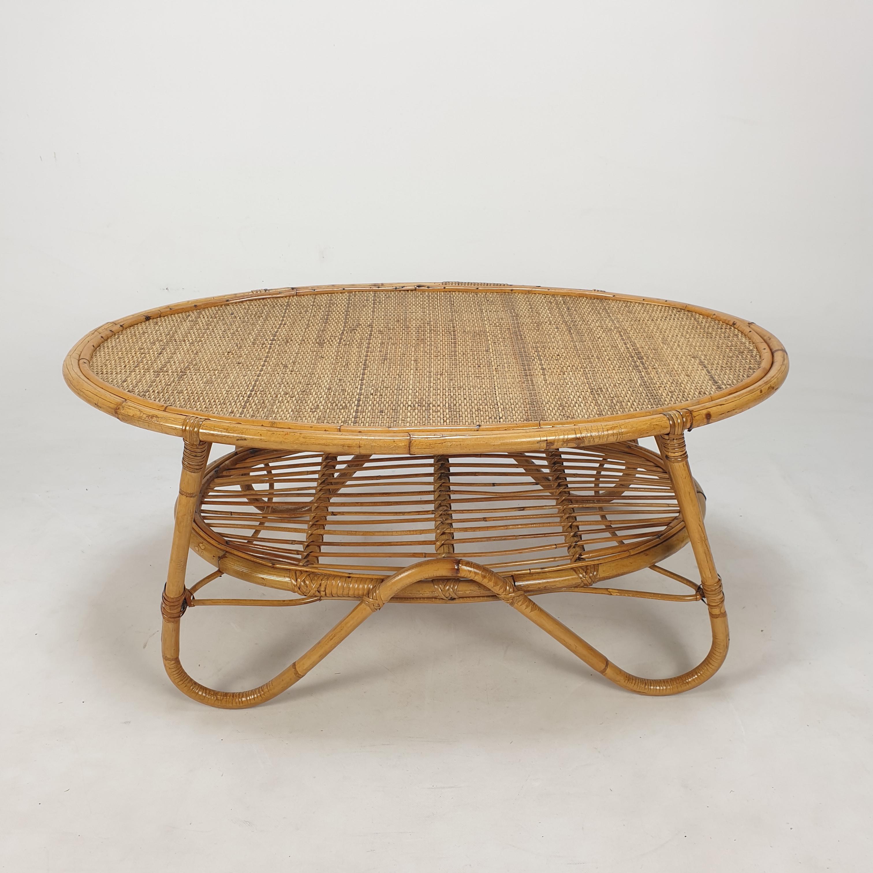 Lovely coffee table, fabricated in Italy in the 60's. 
This very nice table is made of wicker and rattan.