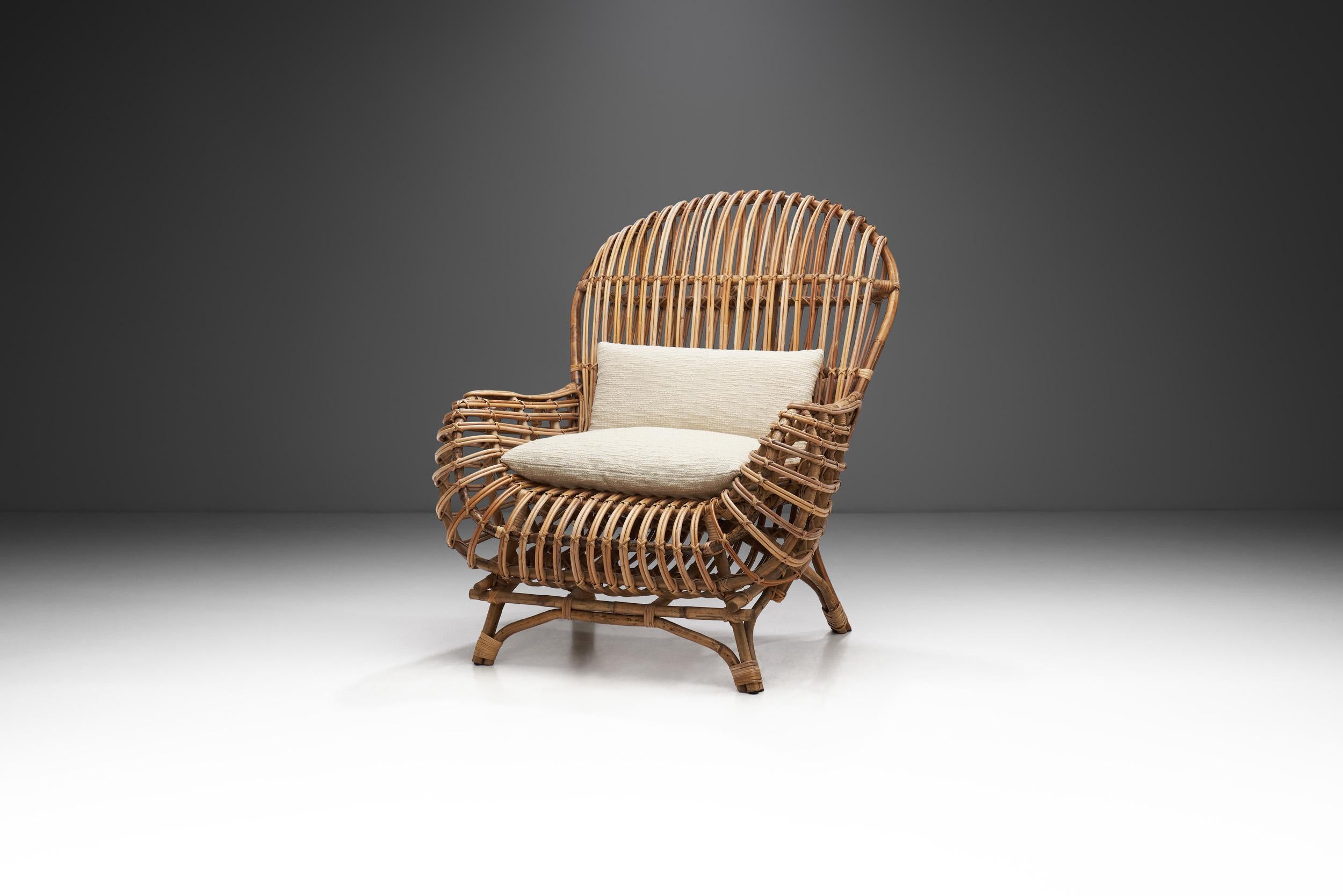 From every angle, this chair is visually arresting; from the front to the sides and back, the curves and geometric lines provide plenty of visual interest. This wicker armchair has a distinct designer edge, and the quality handwoven wicker makes it