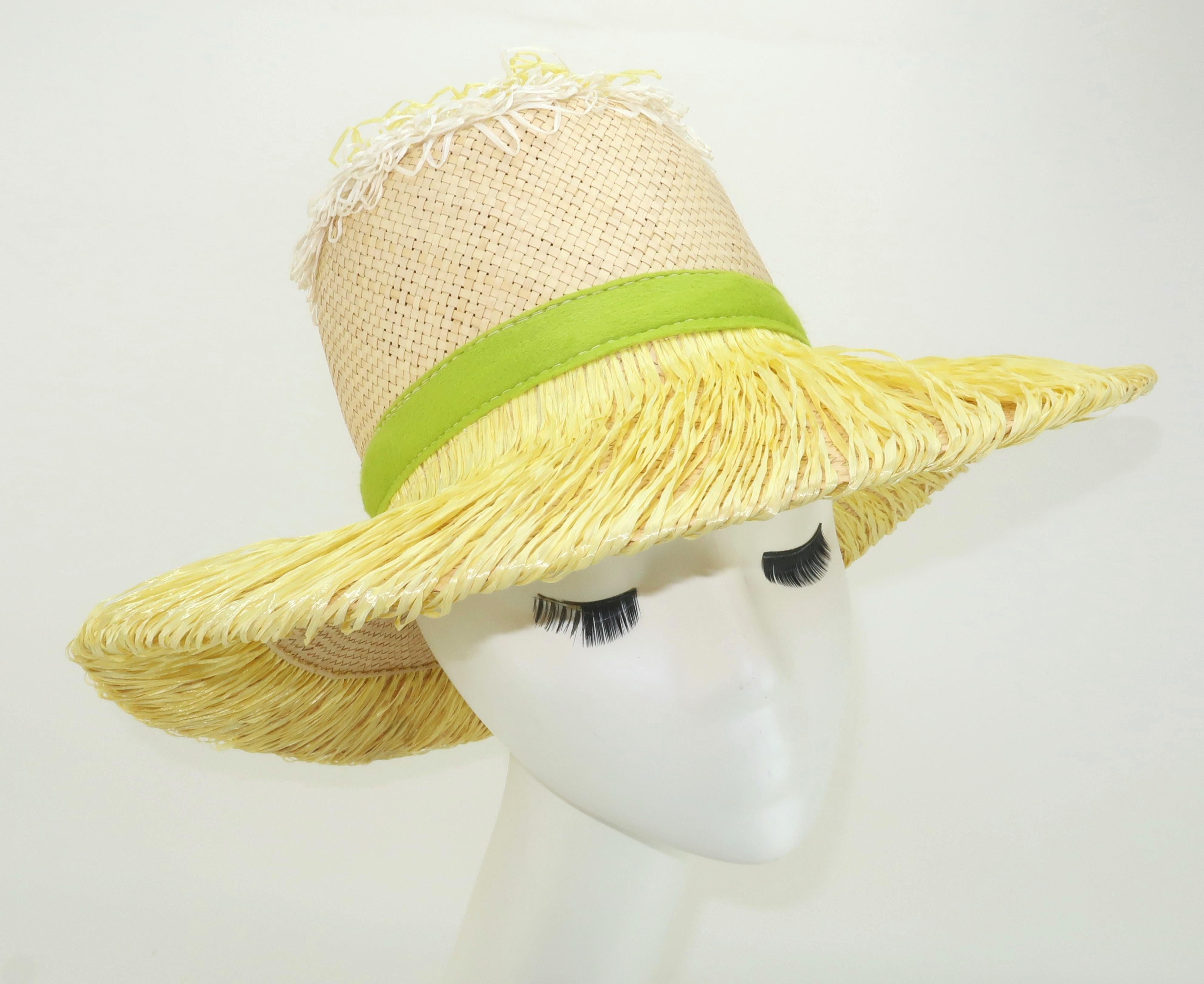 It's time for a little fun in the sun! 1960's Italian straw hat with a wide brim and whimsical yellow and white raffia decoration, including a green felt band, all in a sunflower motif.  The lightweight weave of the straw provides cooling