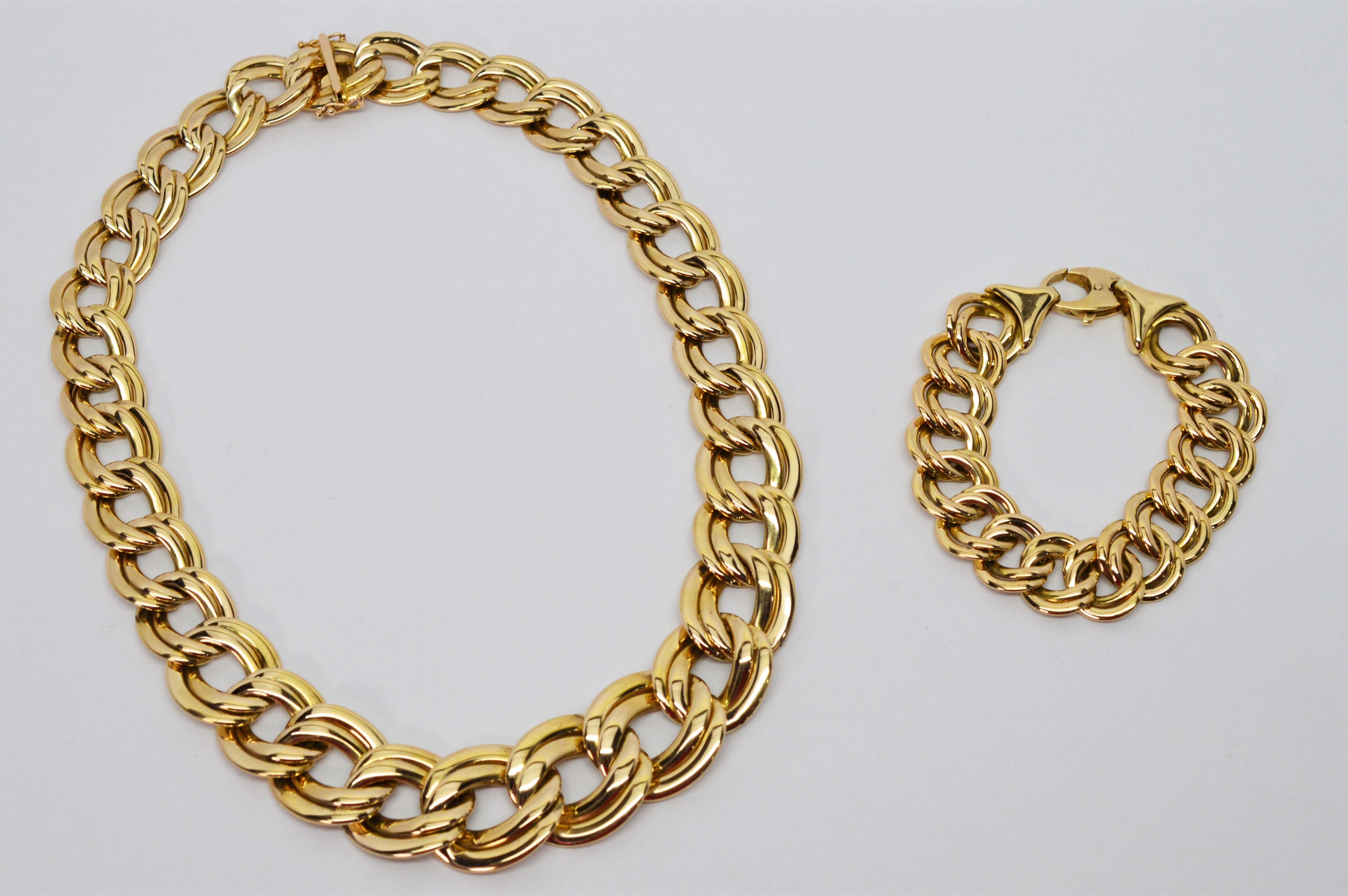 With substantial presence, this double link chain necklace in a 17 inch length and matching 6-3/4 inch  bracelet make a bold and stylish statement.
Italian made in fourteen carat 14K yellow gold, the interlocking chain links, approximately 5/8 inch