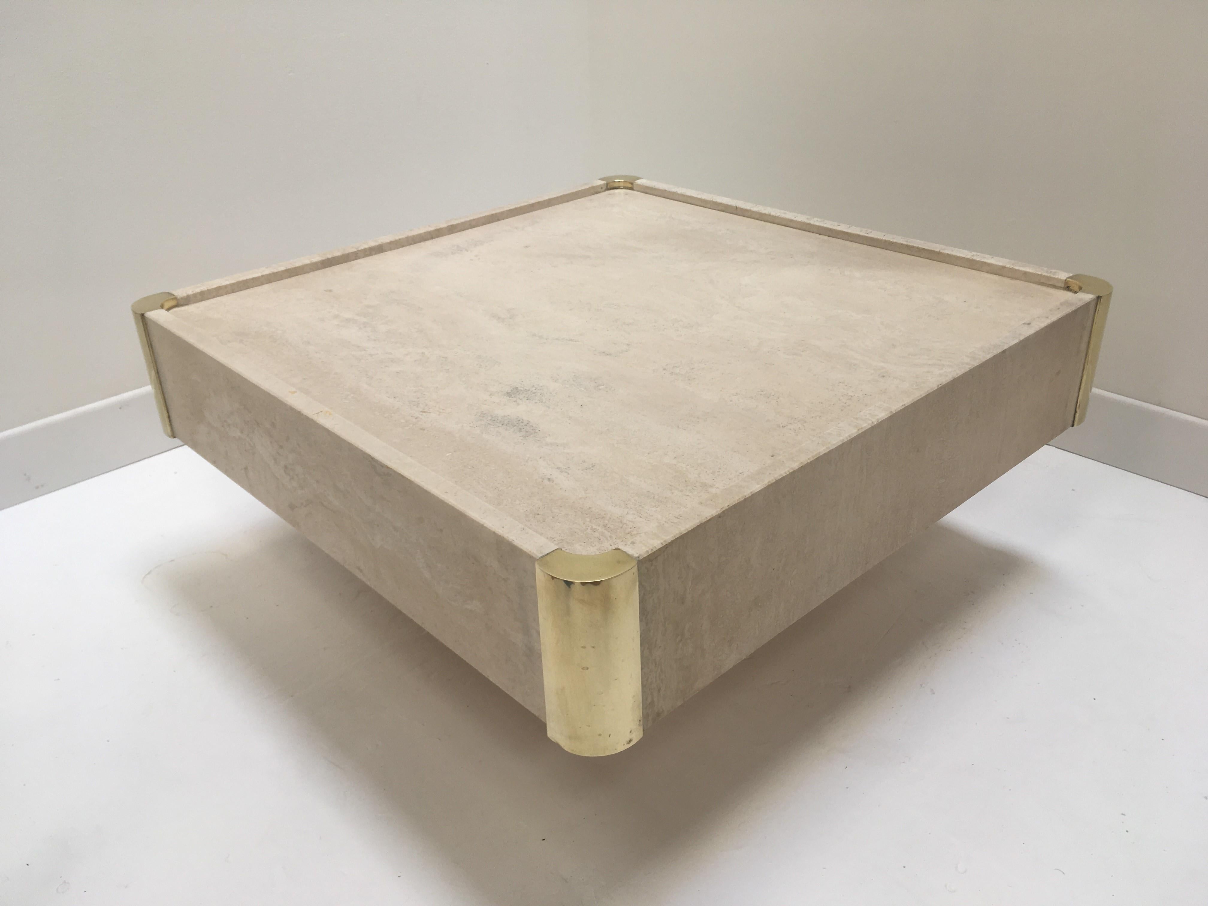 Italian Willy Rizzo 1970s design coffee table, you will be seduced by the charm, the elegance and the presence of this coffee table consisted on a square travertine removal tray adorned with brass corner and a matching square base. All in harmonious