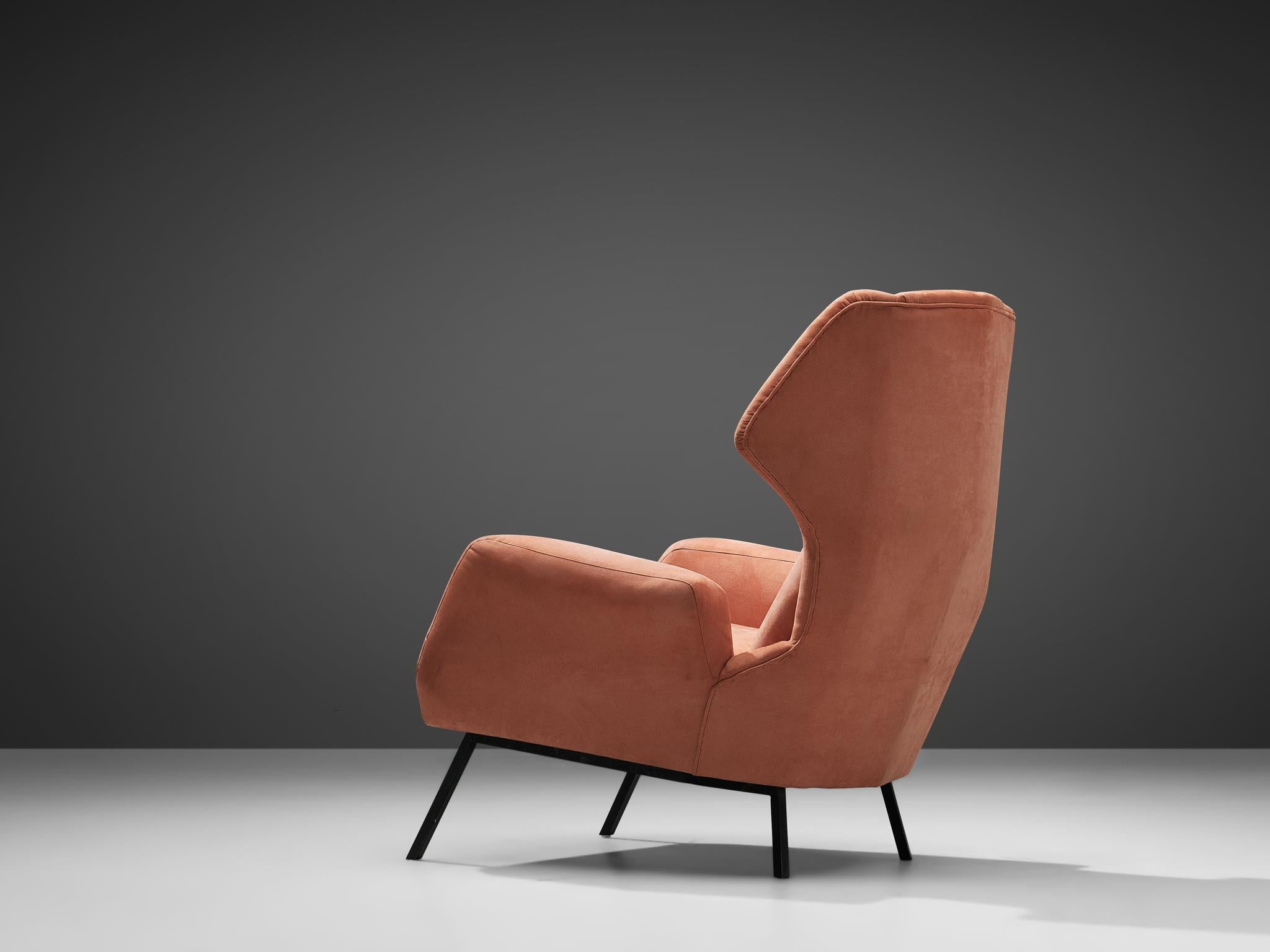 Wingback armchair, alcantara, metal, Italy, 1960s

This Classic Italian post-war wingback lounge chair has an unusually high back and gracious wings that contain dramatized pointed corners. The elegant armrests are slightly curved outwards and the