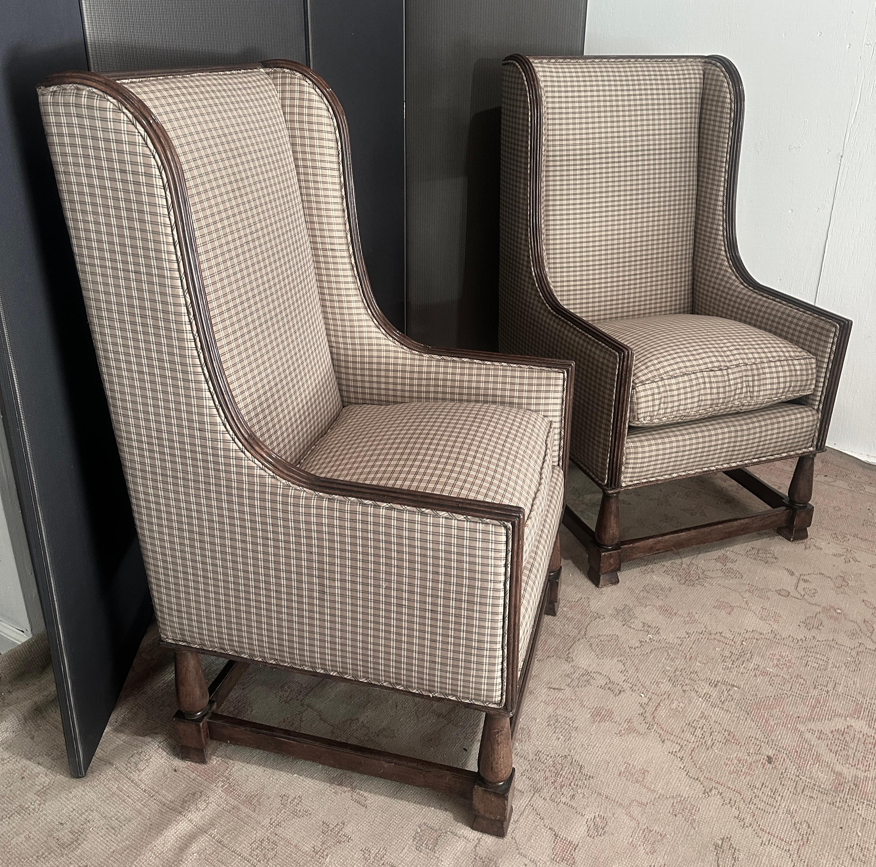 A wonderful pair of wing back chairs, in walnut, hand crafted of the finest
materials, and newly recovered in a classic silk plaid.
The walnut frame is hand carved and very nicely detailed. The upholstery
is well done, the seat cushion down