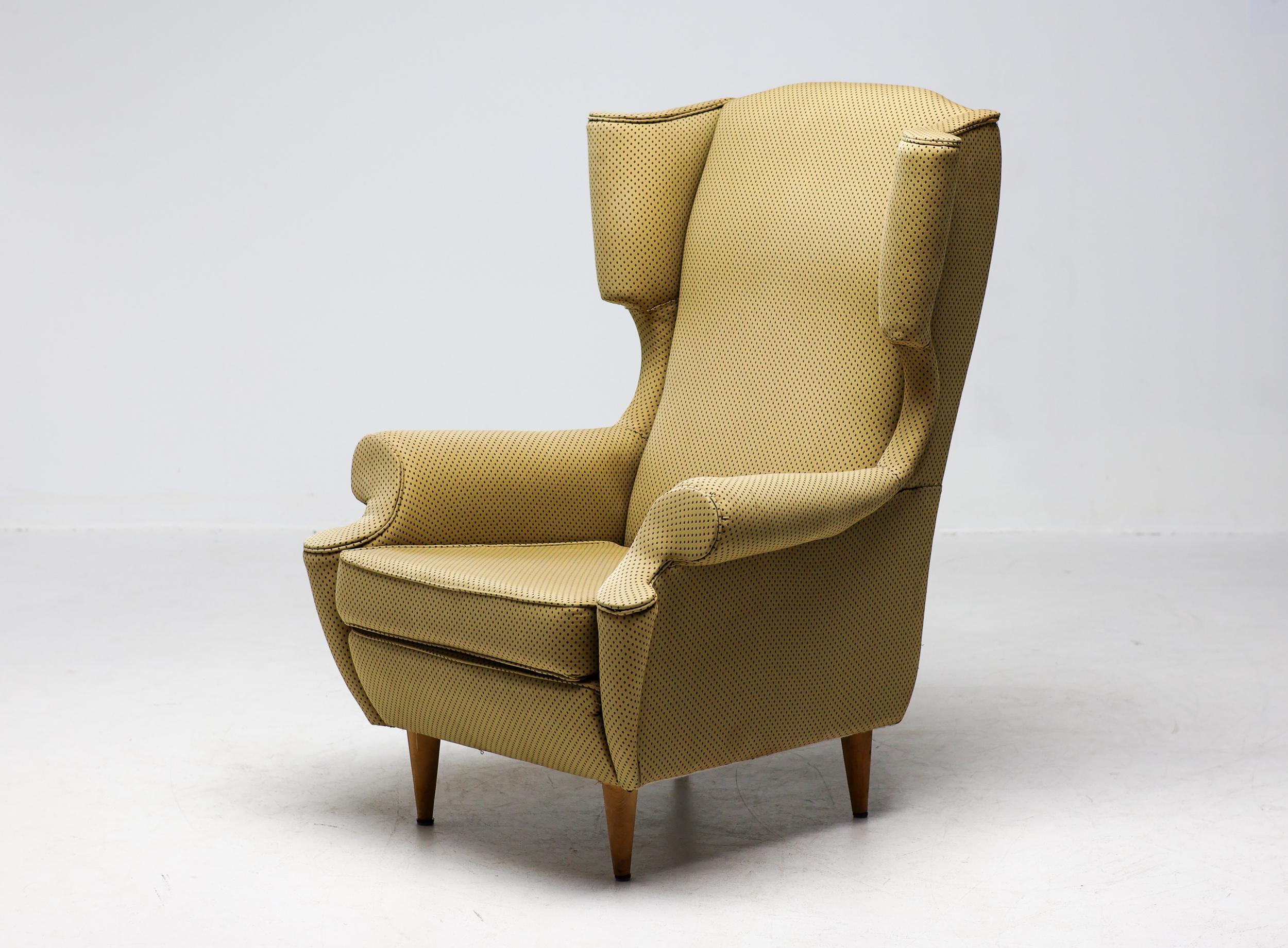Wingback chair, produced by I.S.A. Bergamo, Italy, circa 1950.
Large and very comfortable armchair, reupholstered quite poorly sometime in the past. The fabric is not damaged or soiled but the work just wasn't done to our standards and the fabric