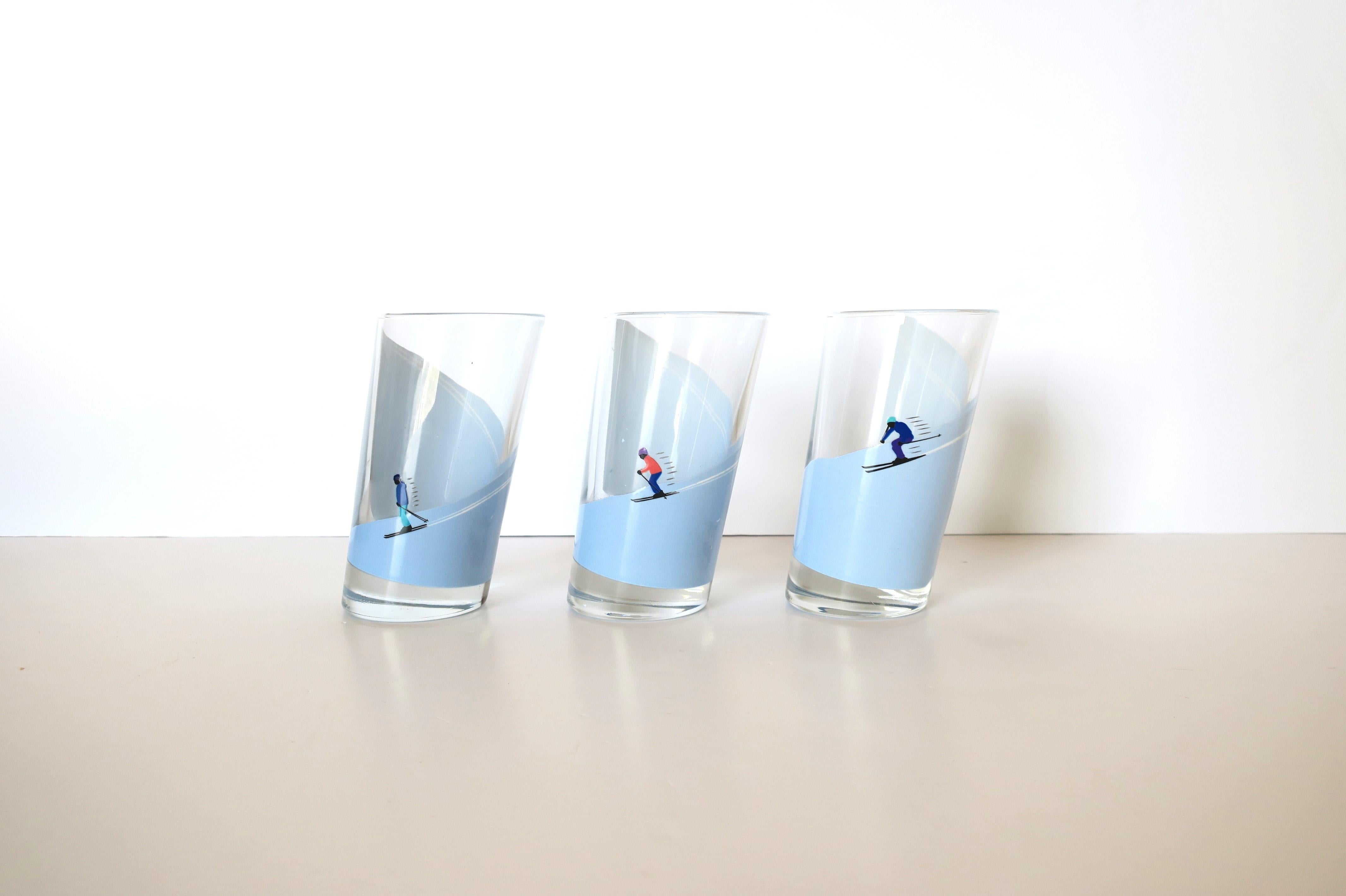 A great set of three (3) Italian highball cocktail glasses with winter alpine snow skier design. Glasses are substantial and strategically designed with an angle cut. Skier's shown on mountain in three different positions. A great set for any bar,