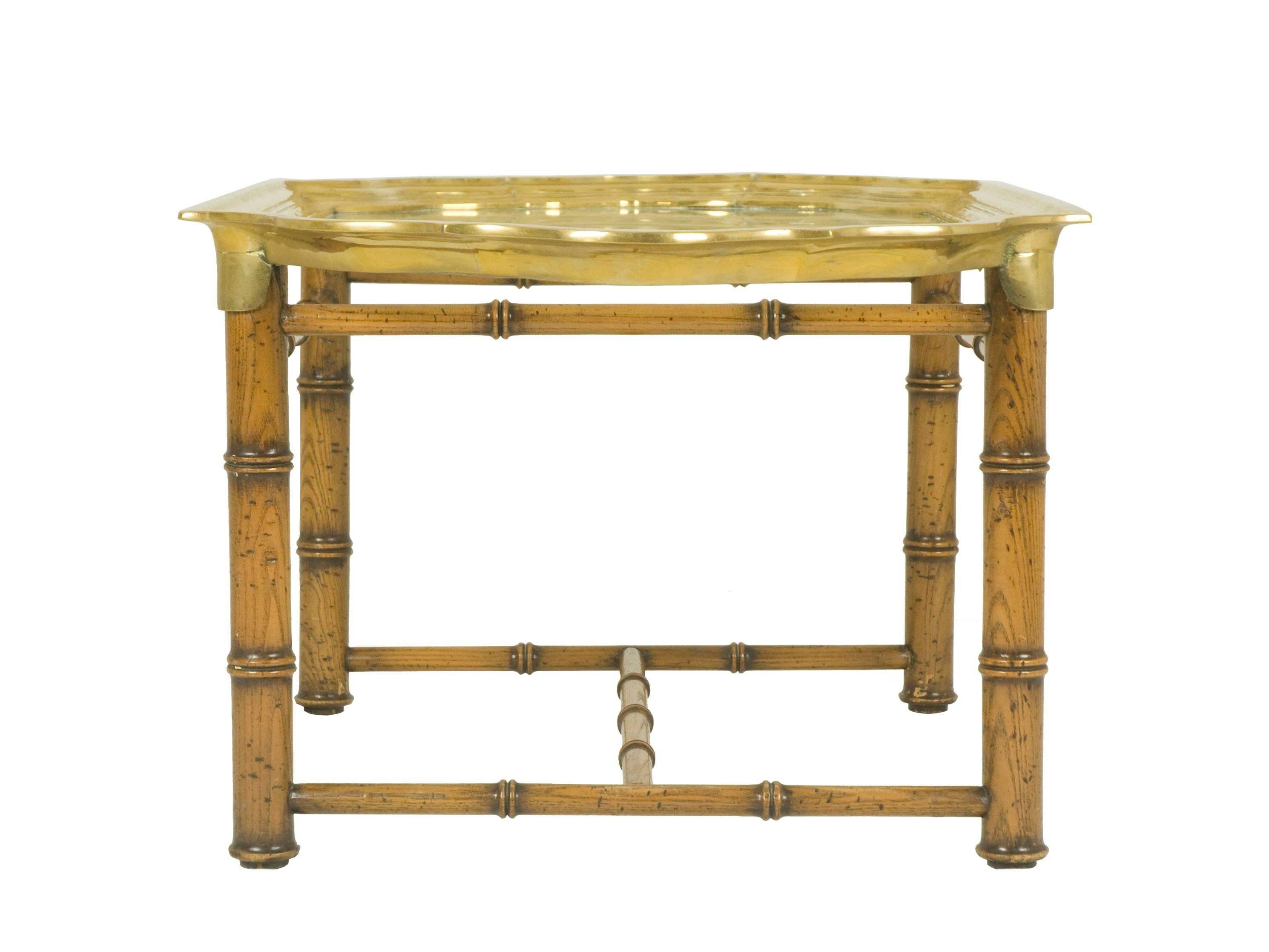 A rare and valuable coffee table in the style of Romeo Rega made from a bamboo-style wooden base with a precious hand-craft brass frame.