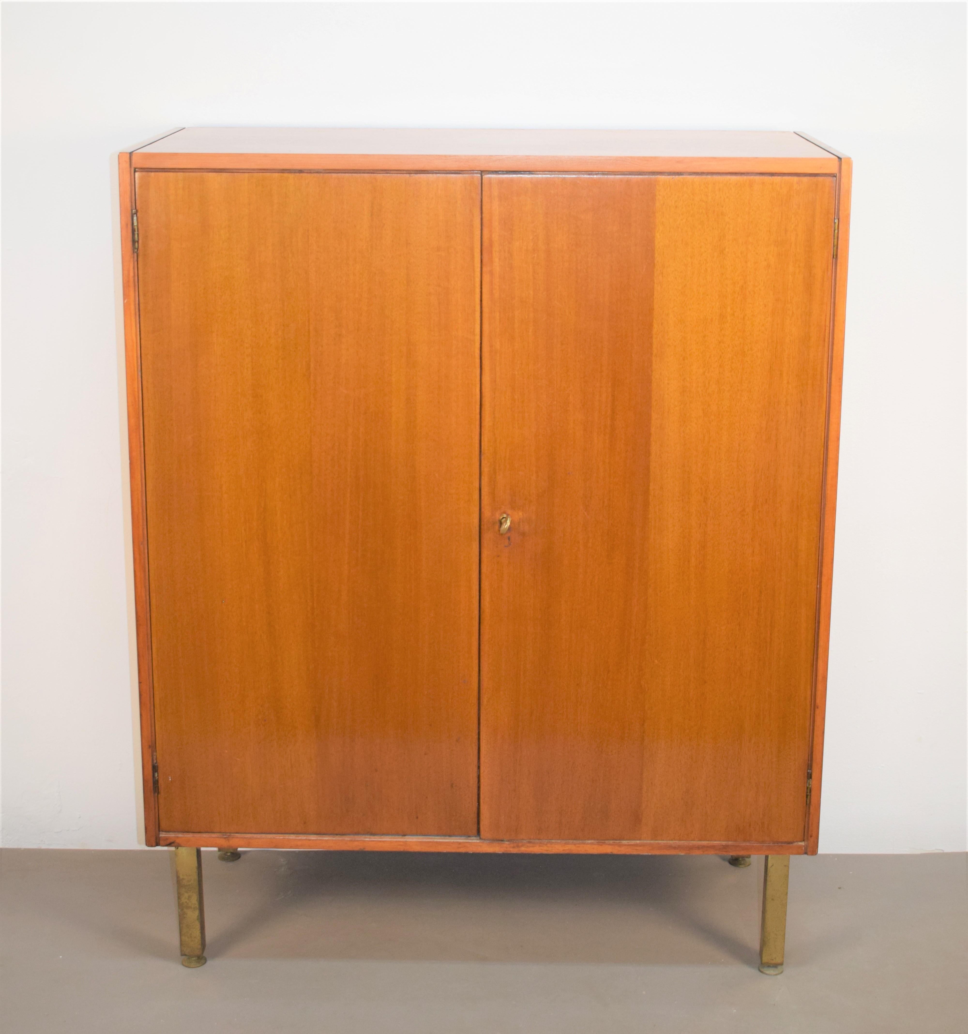 Italian wood and brass cabinet, 1960s.

Dimensions: H= 112 cm; W= 90 cm; D= 40 cm.