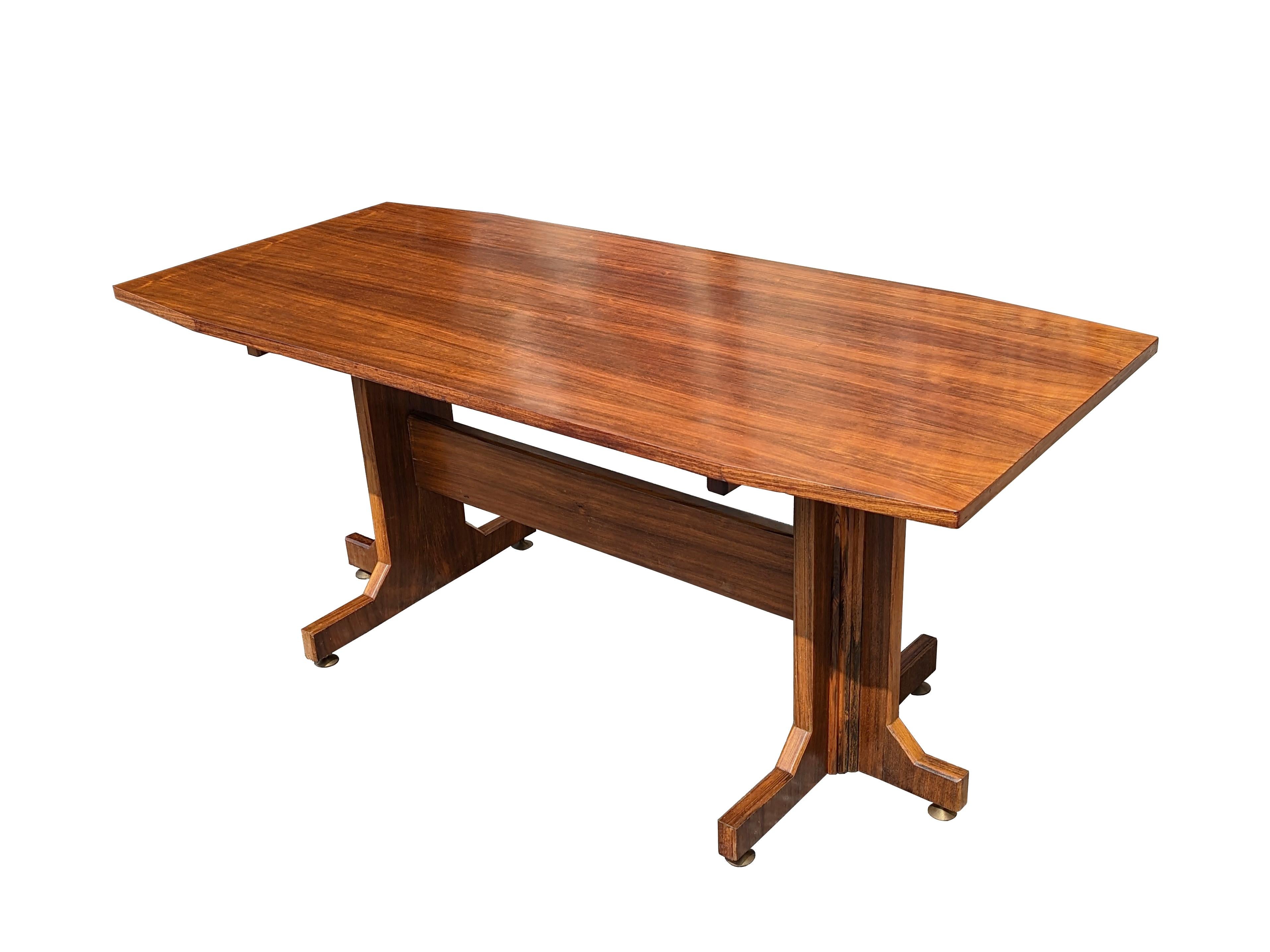 This table was produced in Italy between the 1950s and the 1960s. It's a reinterpretation of the classic Fratino rustic table model. It is made from a wooden structure with 6 adjustable brass feet. Good vintage condition: slight sign of wear on the