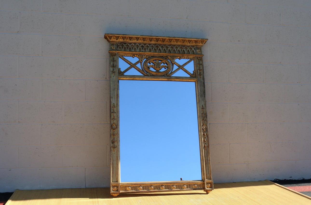 Beautiful Italian wall gold leaf mirror made of wood. In good vintage condition. No damages. To many details, hand carved wood. It is ready to hang it on the wall. Such a wonderful piece.
