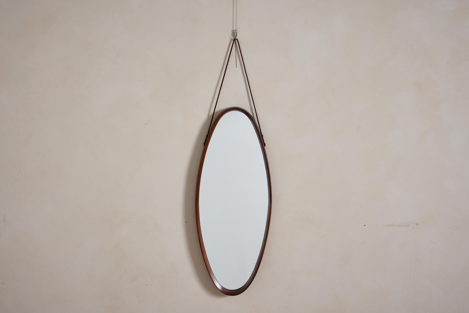 Legno a specchio italiano con splendide giunture e semplice cinturino in pelle. 
