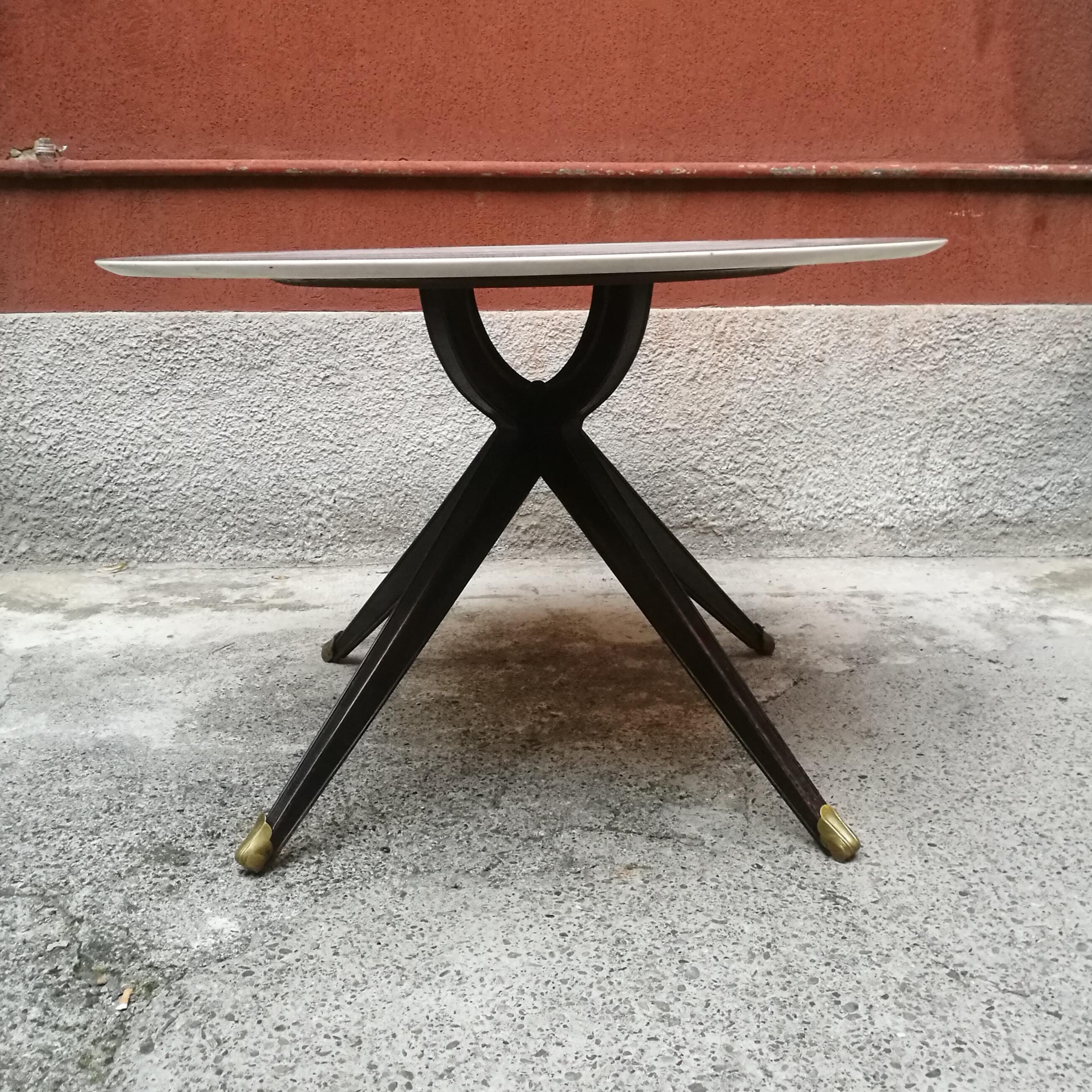 Italian wood and white marble dining table, 1950s
Dining table with statuary marble top and wooden central structure with four legs and brass decoration
Beautiful and in excellent condition.
