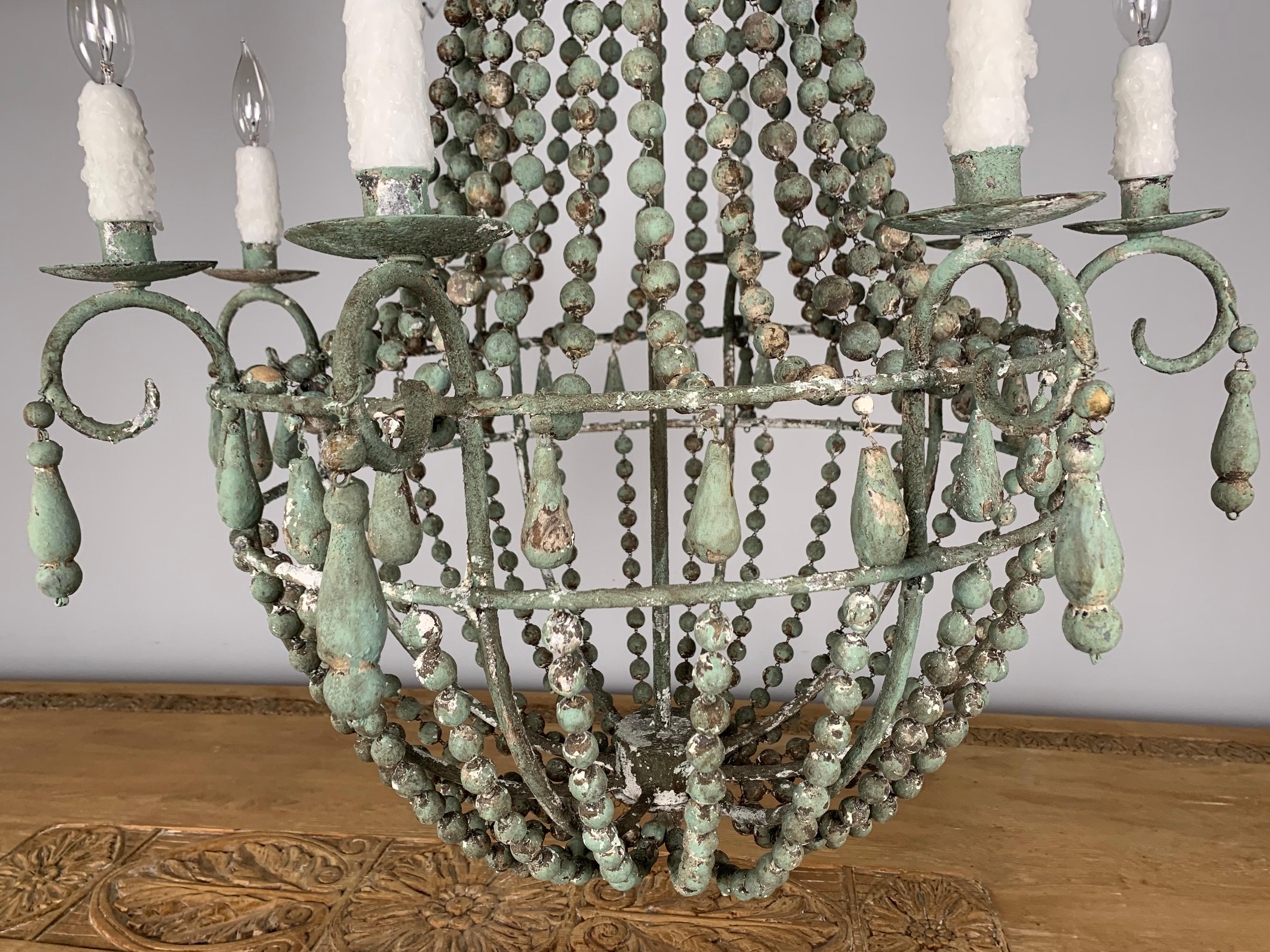 Italian Wood beaded '8' Light Chandelier In Distressed Condition In Los Angeles, CA