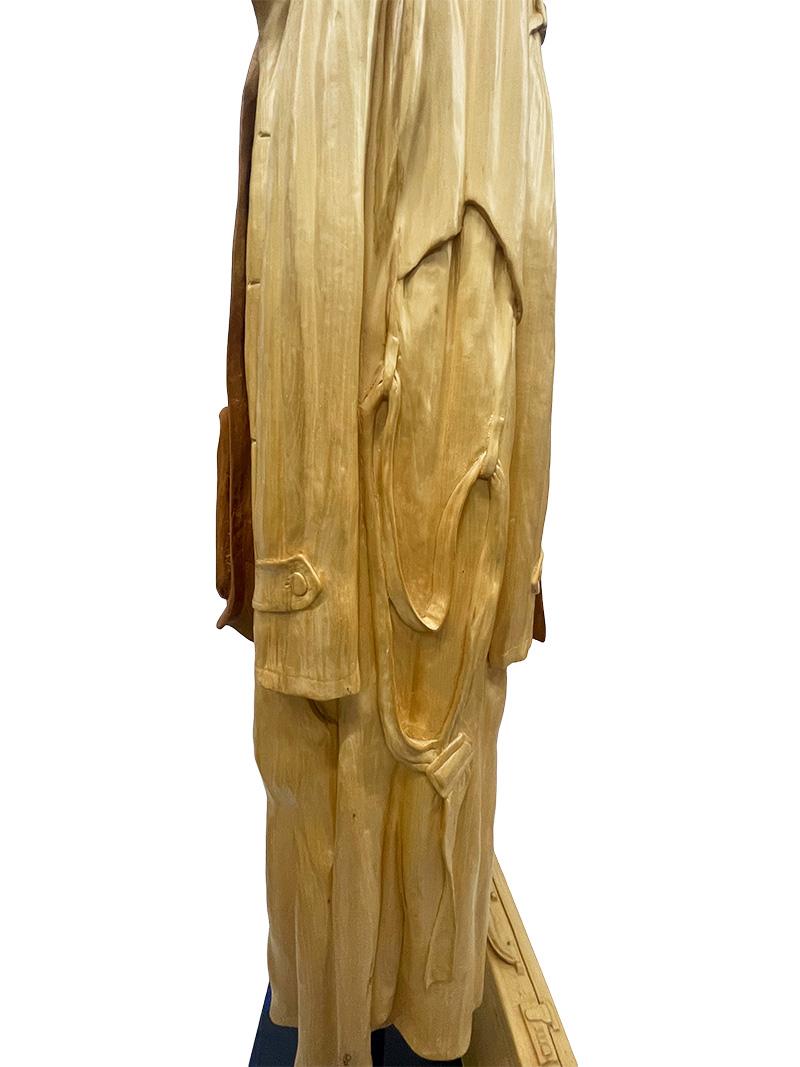 Metal Italian wood-carved sculptures with raincoat and jacket on metal coat rack For Sale