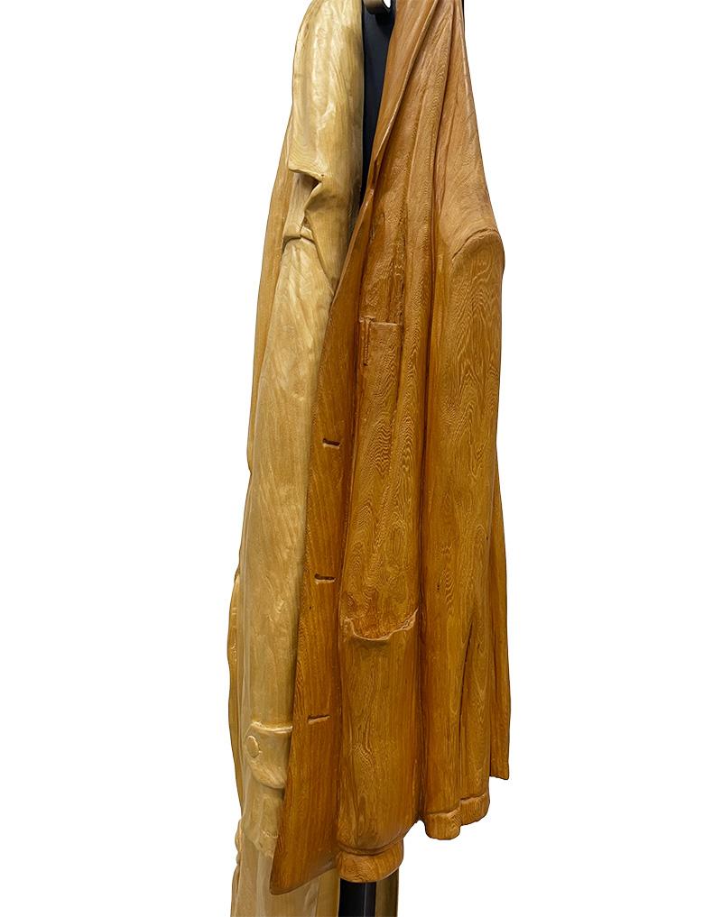 Italian wood-carved sculptures with raincoat and jacket on metal coat rack For Sale 2