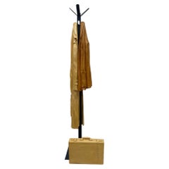 Retro Italian wood-carved sculptures with raincoat and jacket on metal coat rack