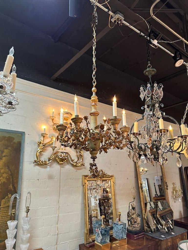 19th century Italian painted wood and iron flower chandelier. Circa 1890. The chandelier has been professionally rewired, comes with matching chain and canopy. It is ready to hang!