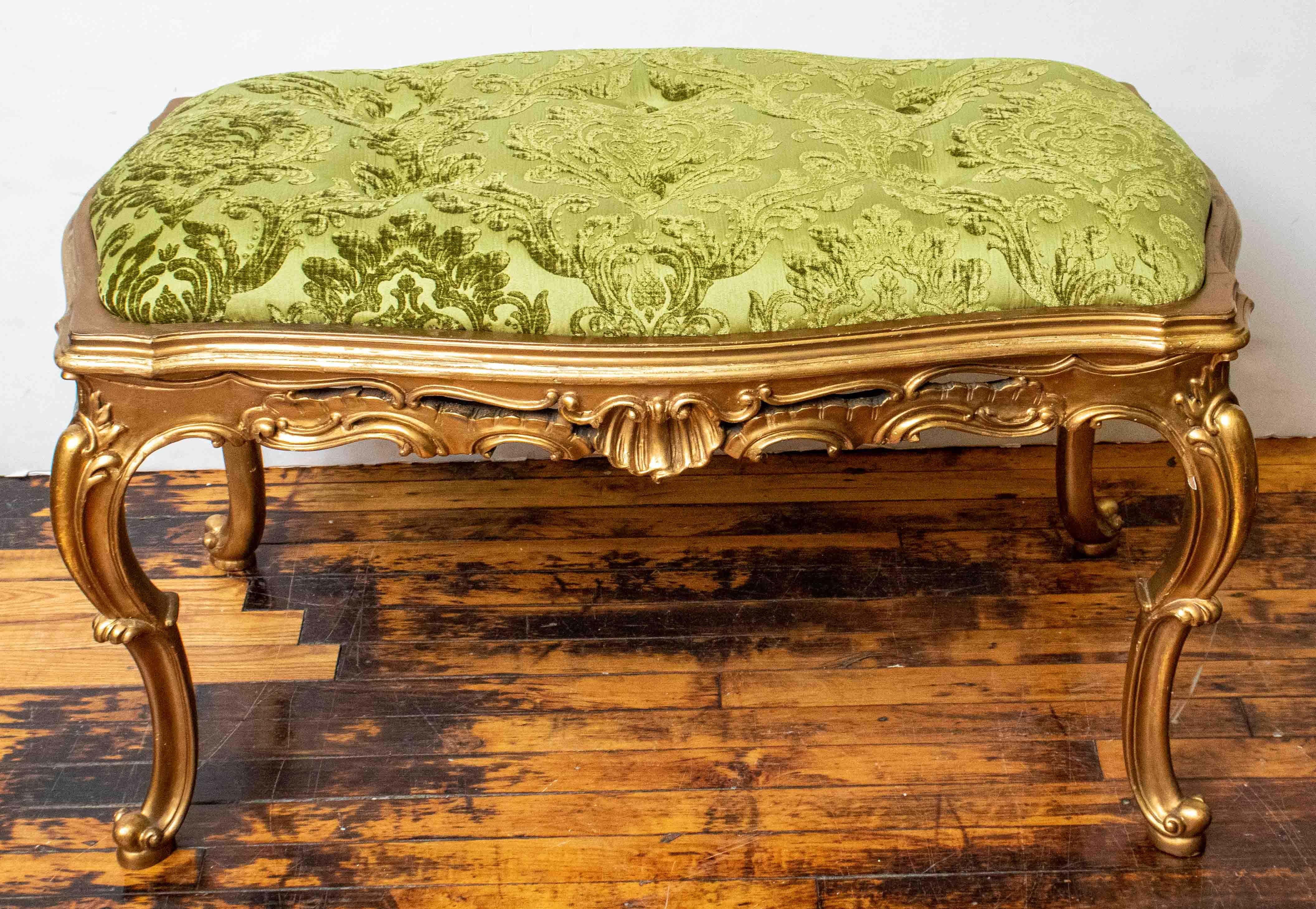 Beautiful Italian wood gilt bench with cushion insert. Made in the 1950's. Cushion was newly upholstered with a grass green cut velvet damask fabric.