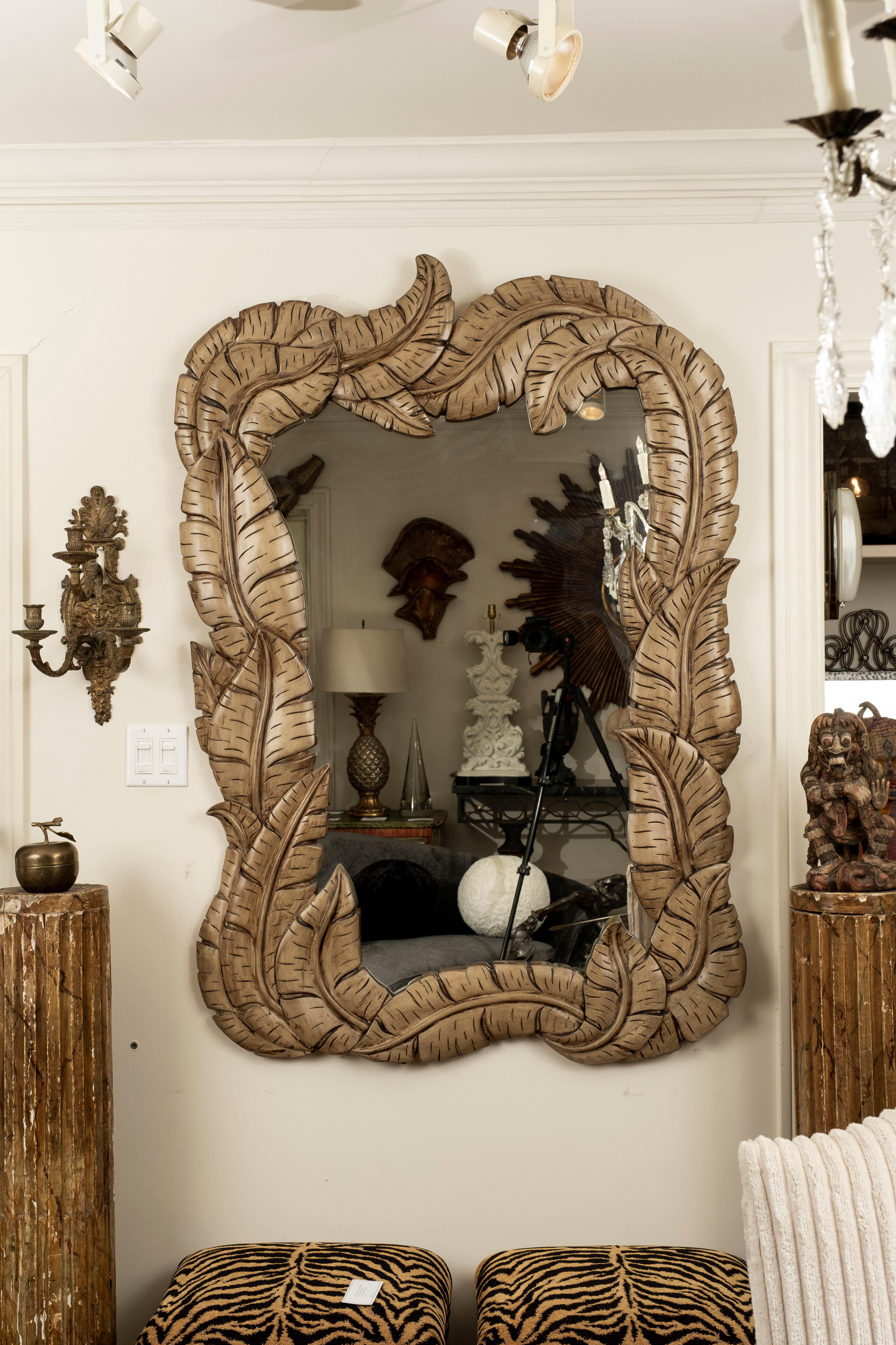 Italian wood palm frond mirror in the Manner of Serge Roche.
Italian carved wood palm frond mirror inspired by Serge Roche. this large well detailed Italian Hollywood Regency organic modern palm frond mirror was executed in a beautiful neutral