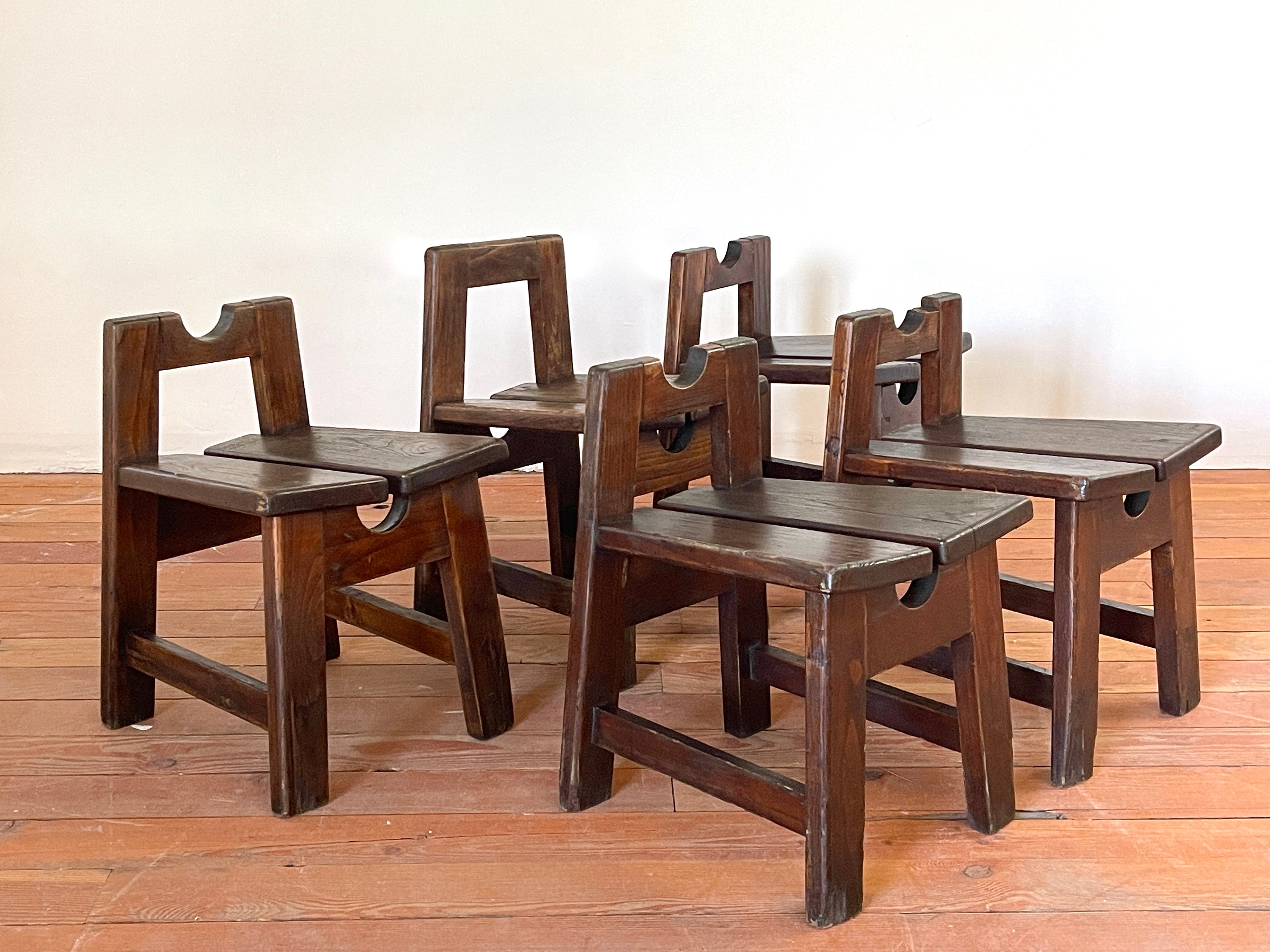 Italian primitive wood stools with great design and patina, circa 1950s. 
Thick wood seats with inverted angular design. 
Great patina. 
Priced individually. 
One stool has slightly different back. 


