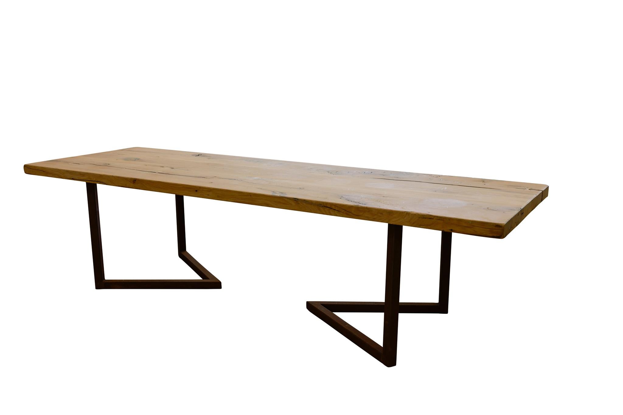 Newly built Italian-style live edge table featuring a modern iron base and repurposed wood that is over 400 years old.

Dimensions: 30.5H x 117.5L x 38W