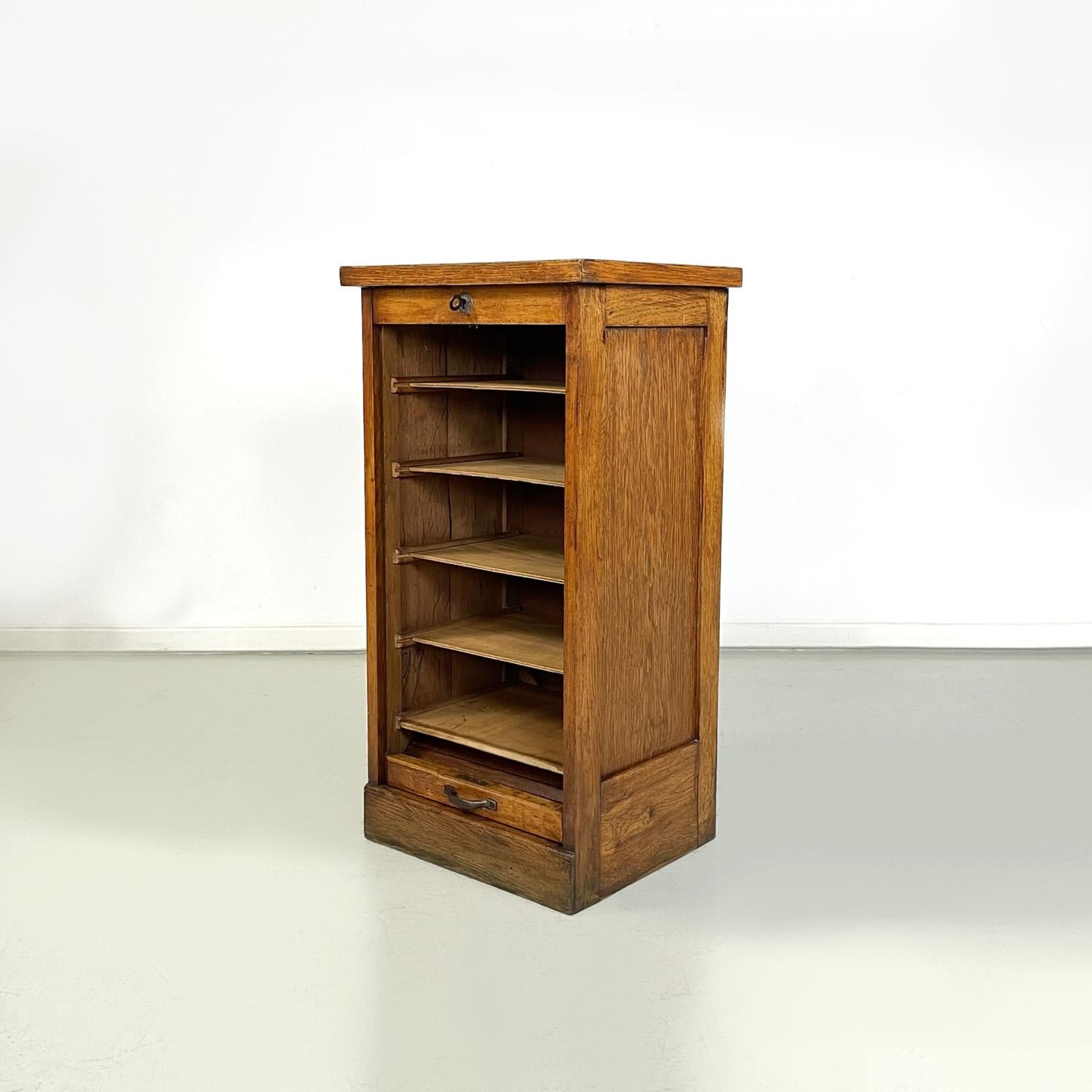 Italian Wooden archive cabinet with a shutter opening and metal handle, 1940s
Office filing archive cabinet with rectangular wooden base. It has a shutter opening, on the inside there are several shelves. The opening handle is made of metal. Key