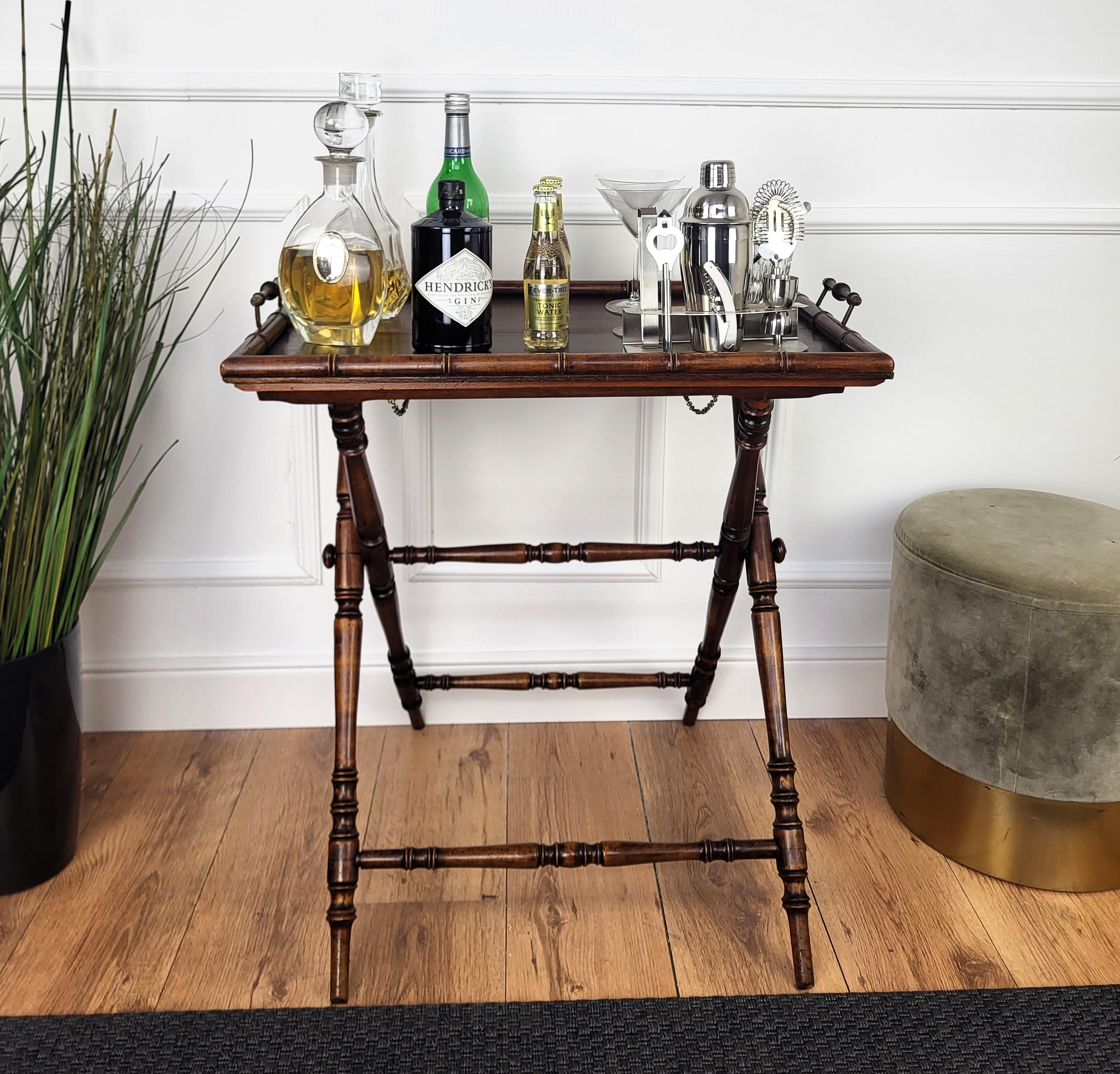 Beautiful folding serving table tray or butler's stand with carved x-stand base and classic tray with side handles.

