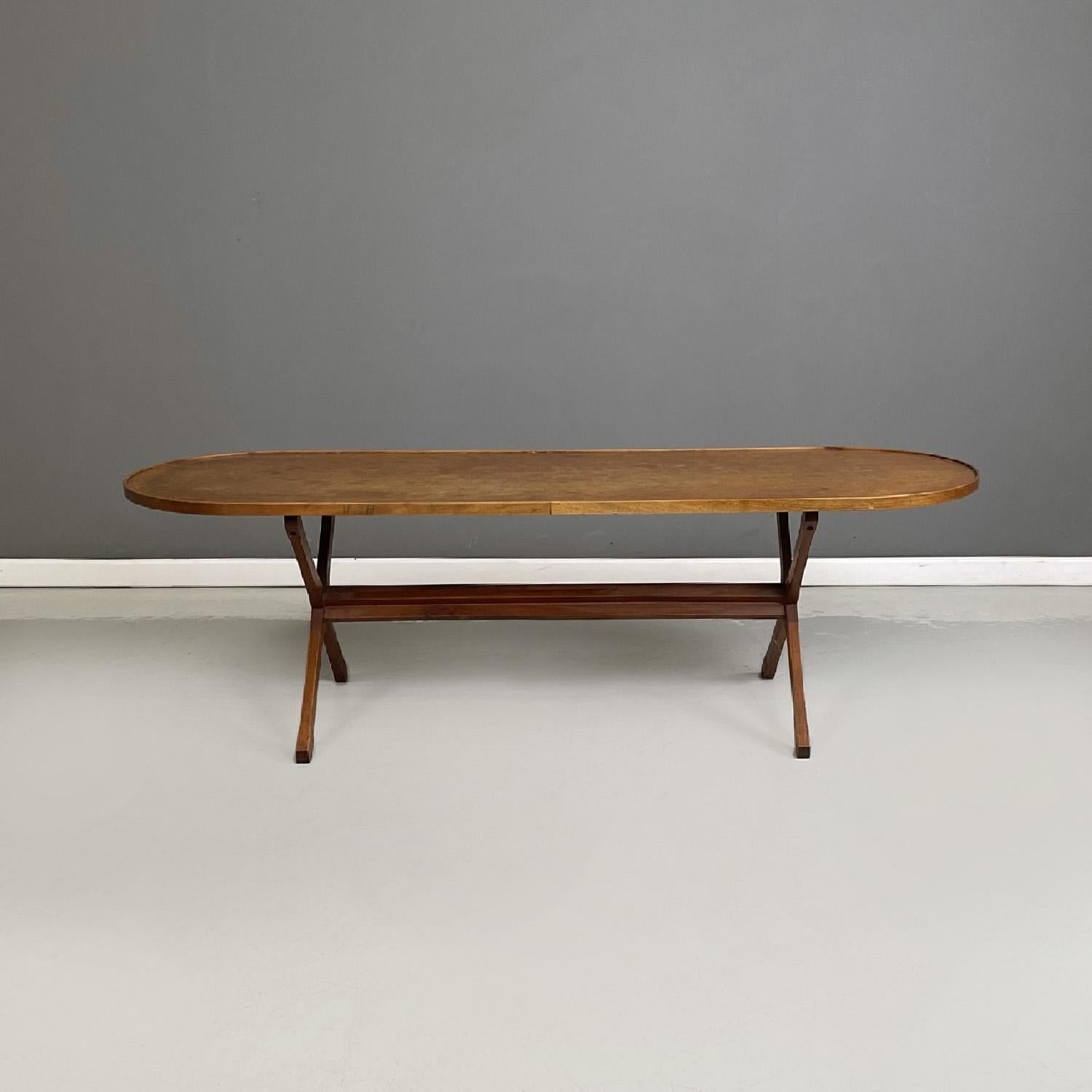  Italian mid-century modern wooden coffee table by Franco Albini e Franca Helg for Mobilia, 1960s
Oval-shaped coffee table made entirely of wood. The top has a slight border around the entire perimeter. The legs are on the sides of the top and are