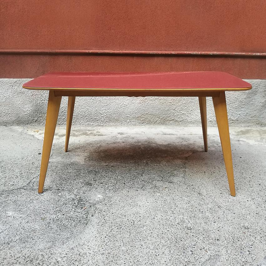 Italian wooden dining table with pink glass top, 1960s
Typical 1960s Italian dining table with original pink glass top and legs in shaped wood with decorations along the four sides of the structure.
Perfect for an elegant kitchen or dining room.