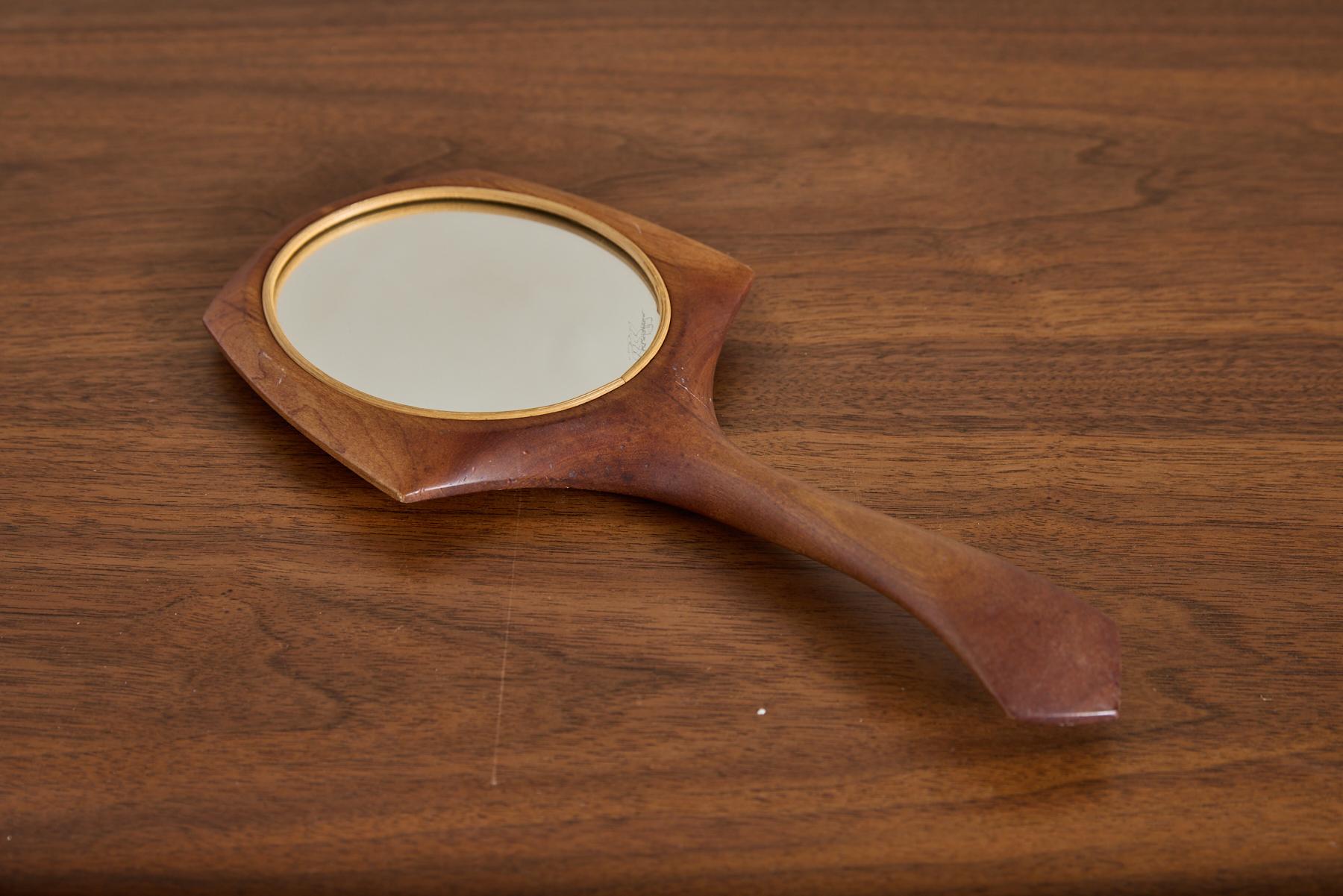 1950's Italian teak Hand Mirror with svelte shape
