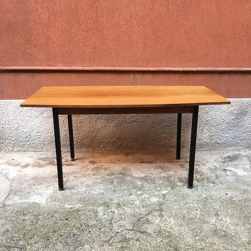 Italian wooden, metal and brass dining table, 1960s. Dining table with wooden top and enameled metal structure and brass tips
Good condition, under restoration.