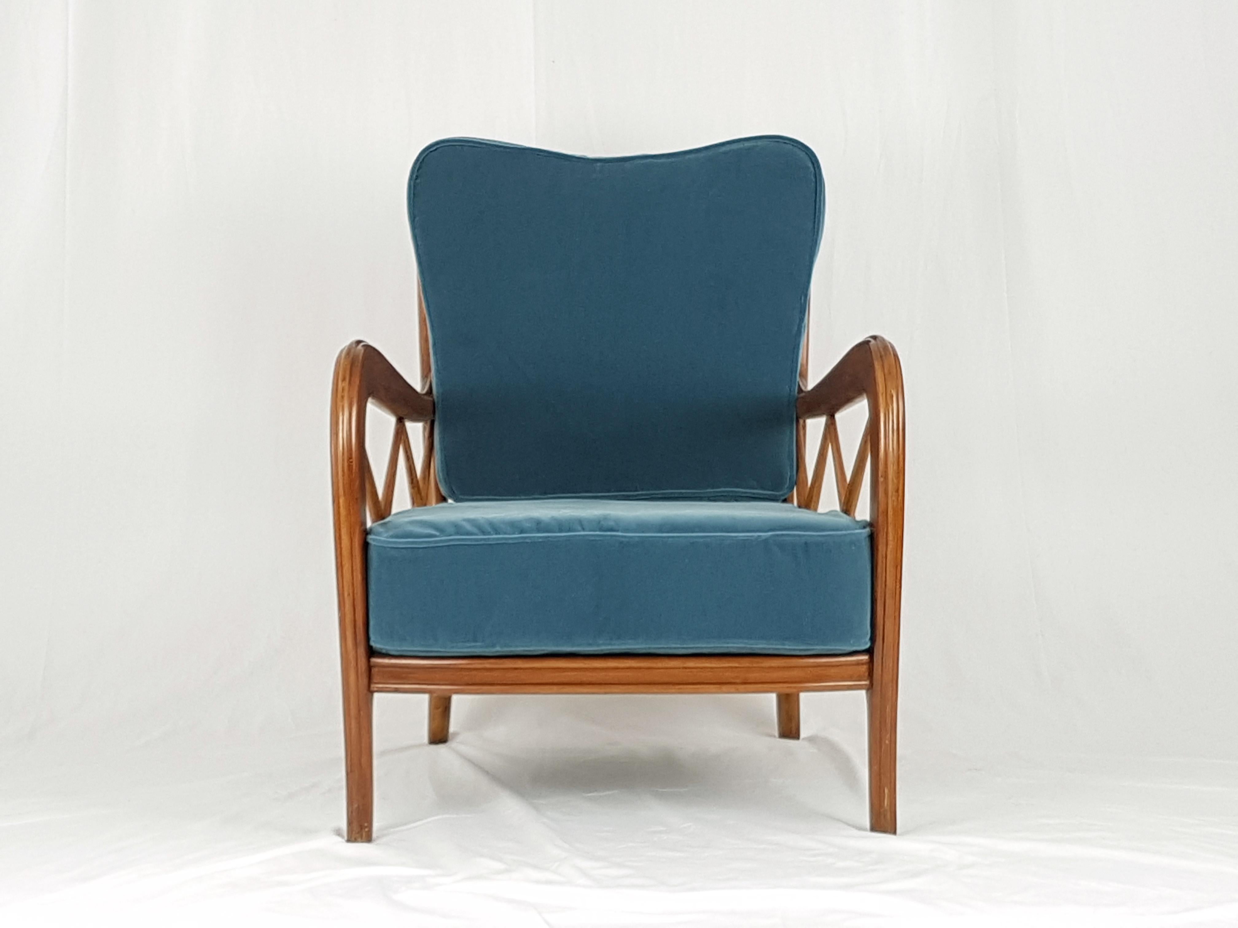 This beautiful armchair was produced in Italy around the 1940s. It is attributed to the famous italian architect and designer Paolo Buffa.
The armchair is made from a wooden structure with a wire mesh with two elegant mid blue velvet cushions. The