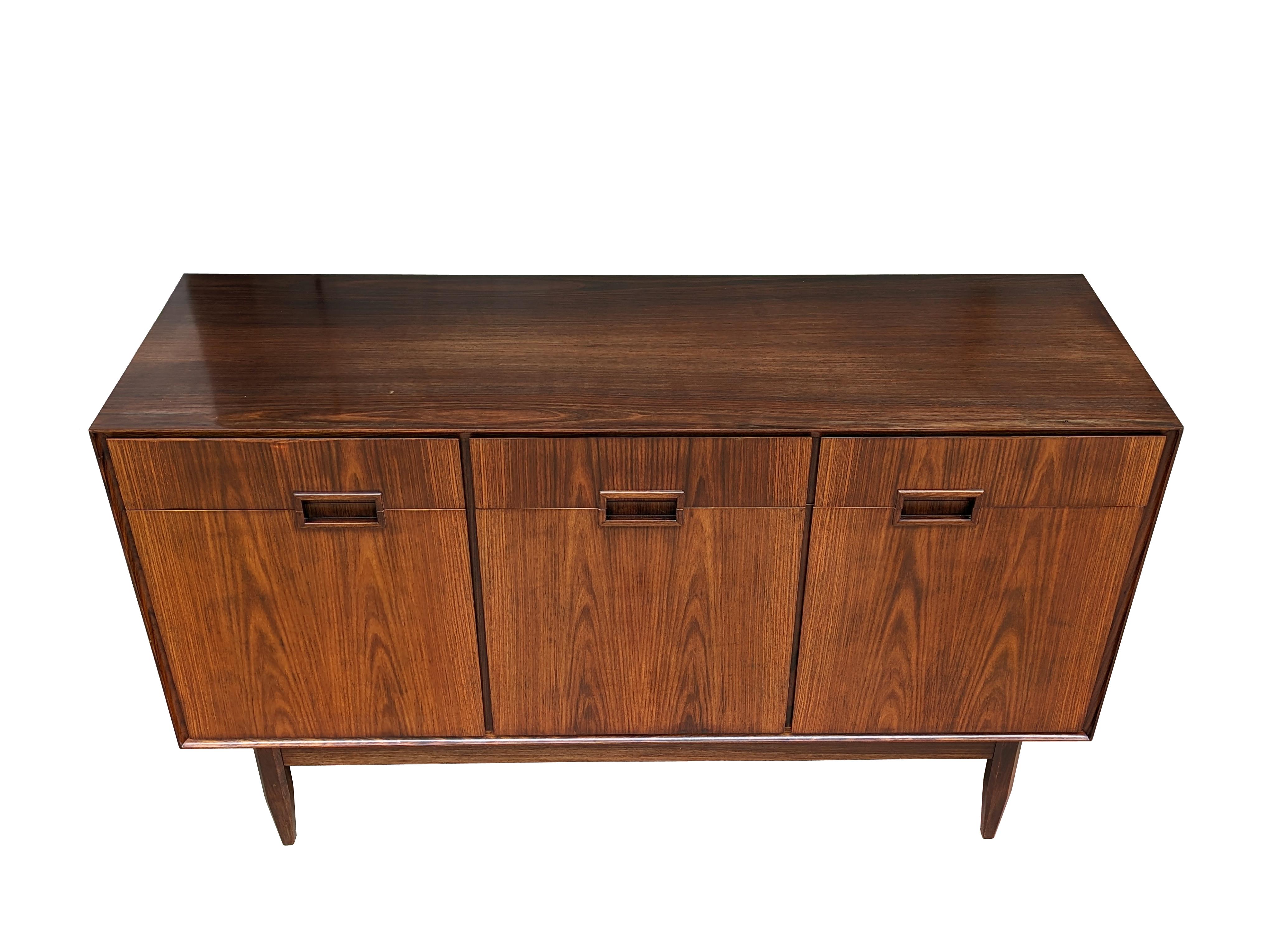 A beautiful pair of small-sized sideboard designed and manufactured in the 1950s. 
Each cabinet is equipped with 3 drawers in the upper part and 3 doors in the lower part. The small dimensions (cm  84h x 140 w x 45 d) allow for easy placement, even