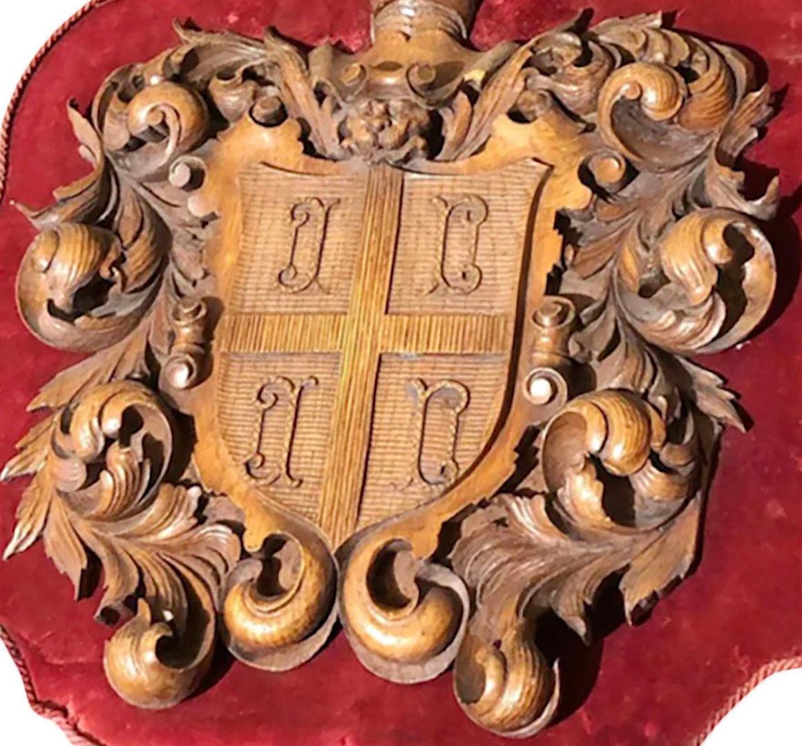 Carved Wooden Shield With Knight and Heraldic Carvings In Good Condition For Sale In Dallas, TX