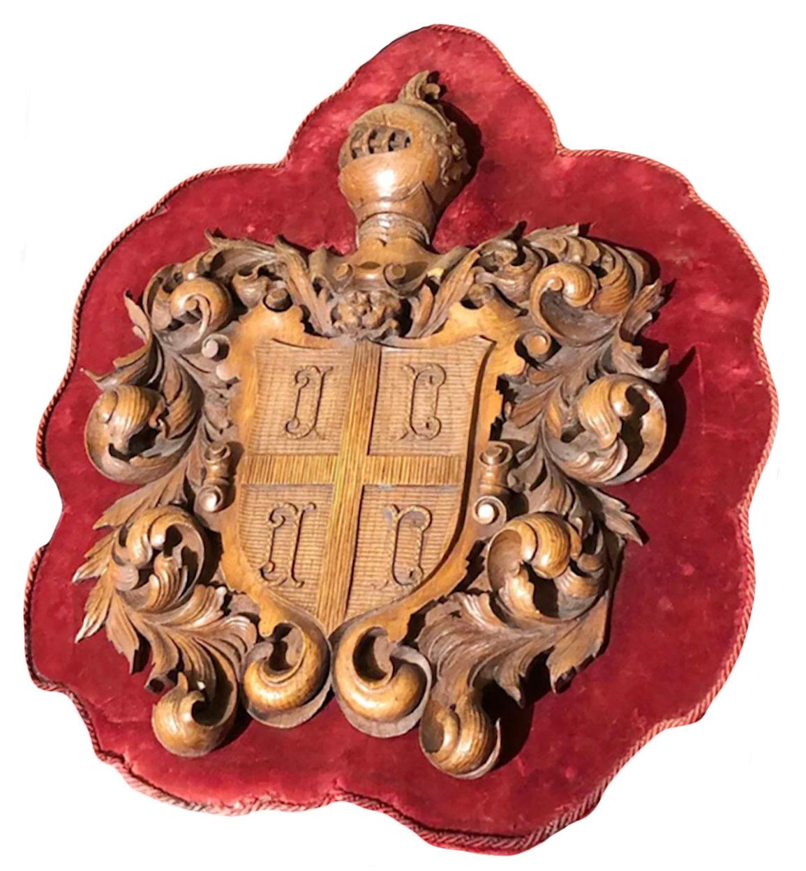 Velvet Carved Wooden Shield With Knight and Heraldic Carvings For Sale