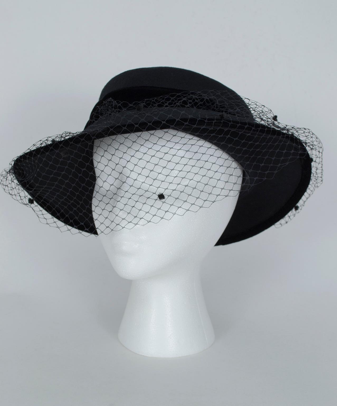 One of the premiere luxury milliners of the 20th century, Marzi still makes the Florentine straw hats young Englishwomen coveted over 100 years ago on their Grand Tours of Europe. With its tasteful yet somber veil, this one reminds us of the hat