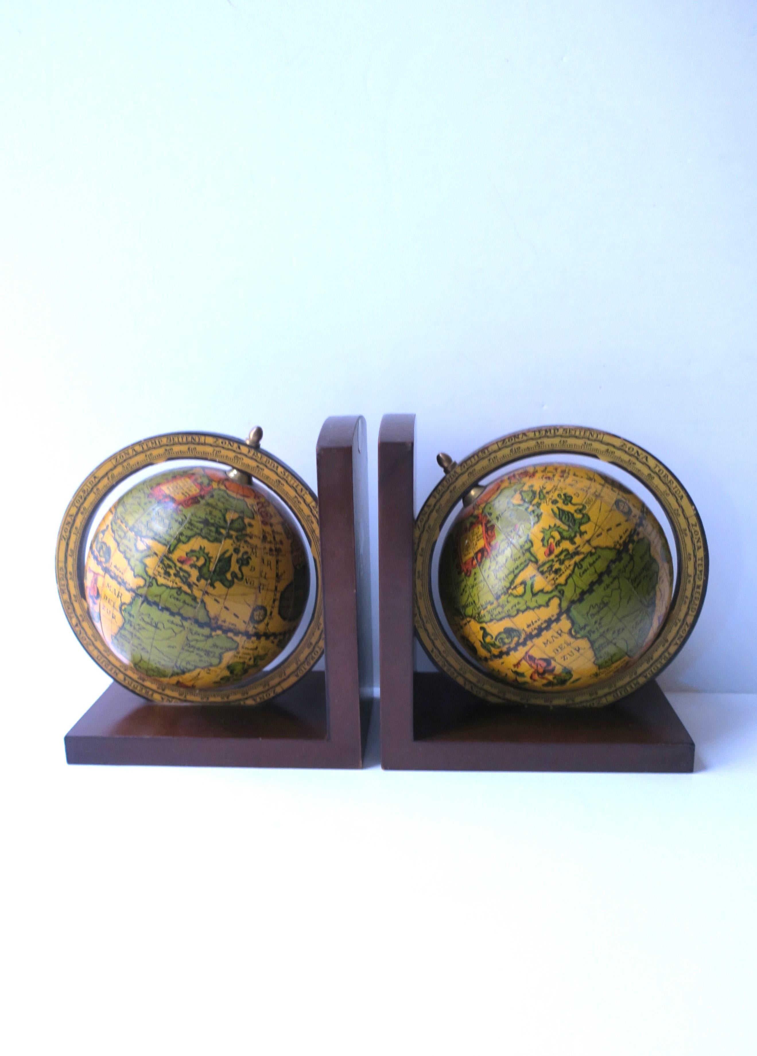 An Italian pair of world globe bookends with brass accents, circa mid-20th century, Italy. A great pair for an office, library, living room, etc. Marked 'Made in Italy' on back as shown in last three images. Very good condition as shown in images