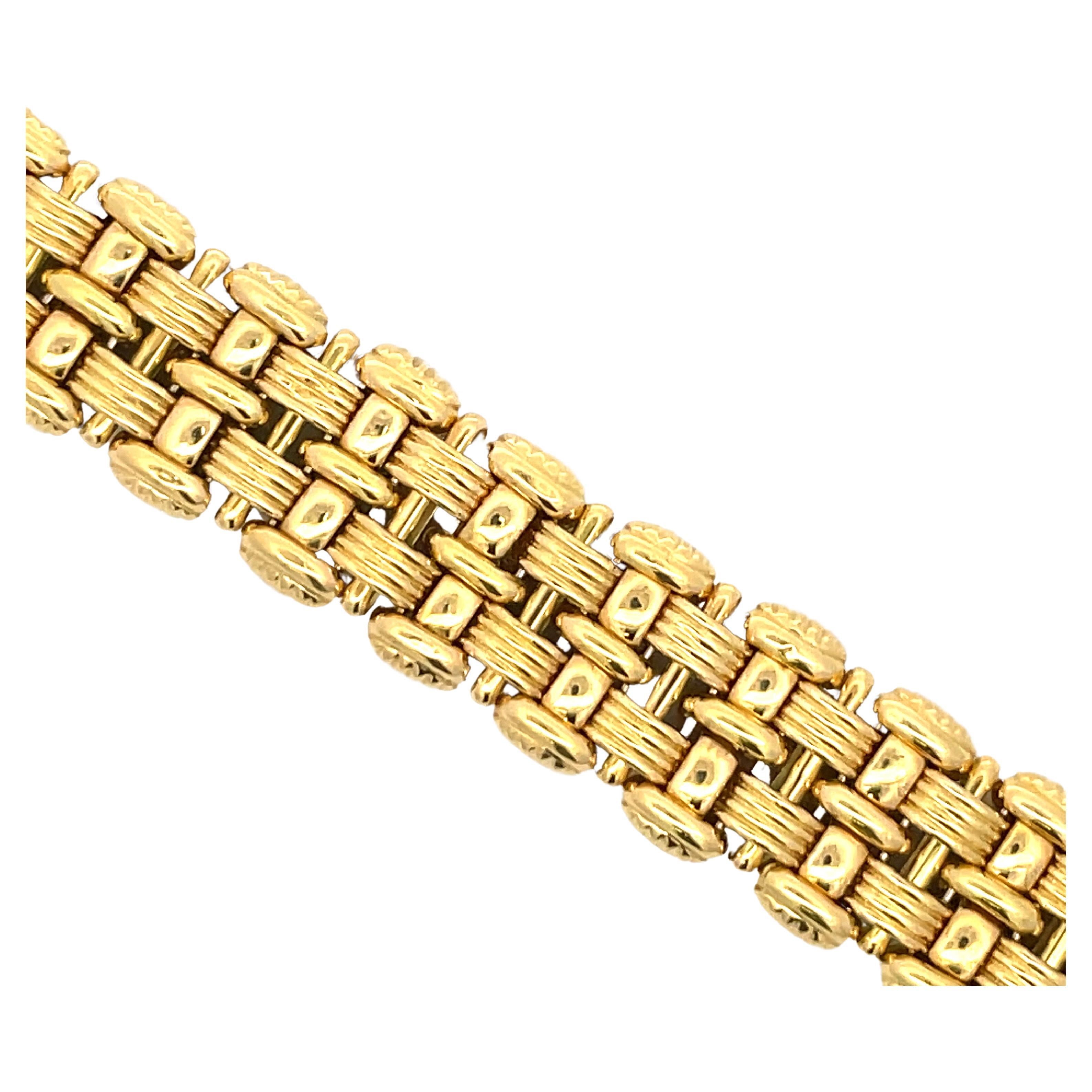 18 Karat Yellow Gold bracelet featuring a woven motif design weighing 47.1 grams, made in Italy.
Stamped Italy 18k 
Designer OTC

More gold bracelets available.
Search Harbor Diamonds 